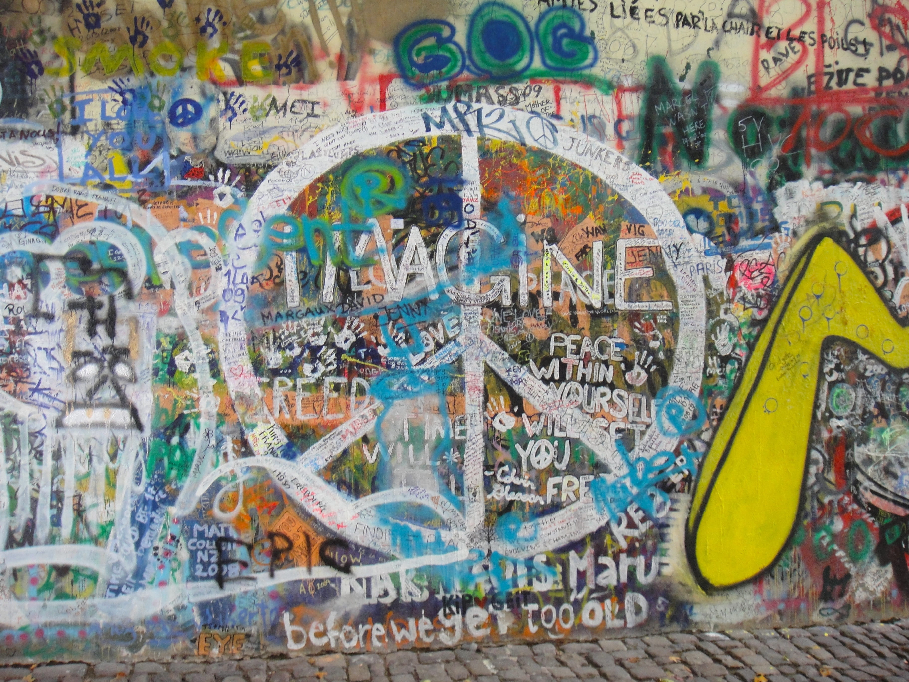 john lennon wall, creativity, wall, multi colored, city, communication, male likeness, human representation, sport, wall art, travel destinations, representation, HD Wallpaper