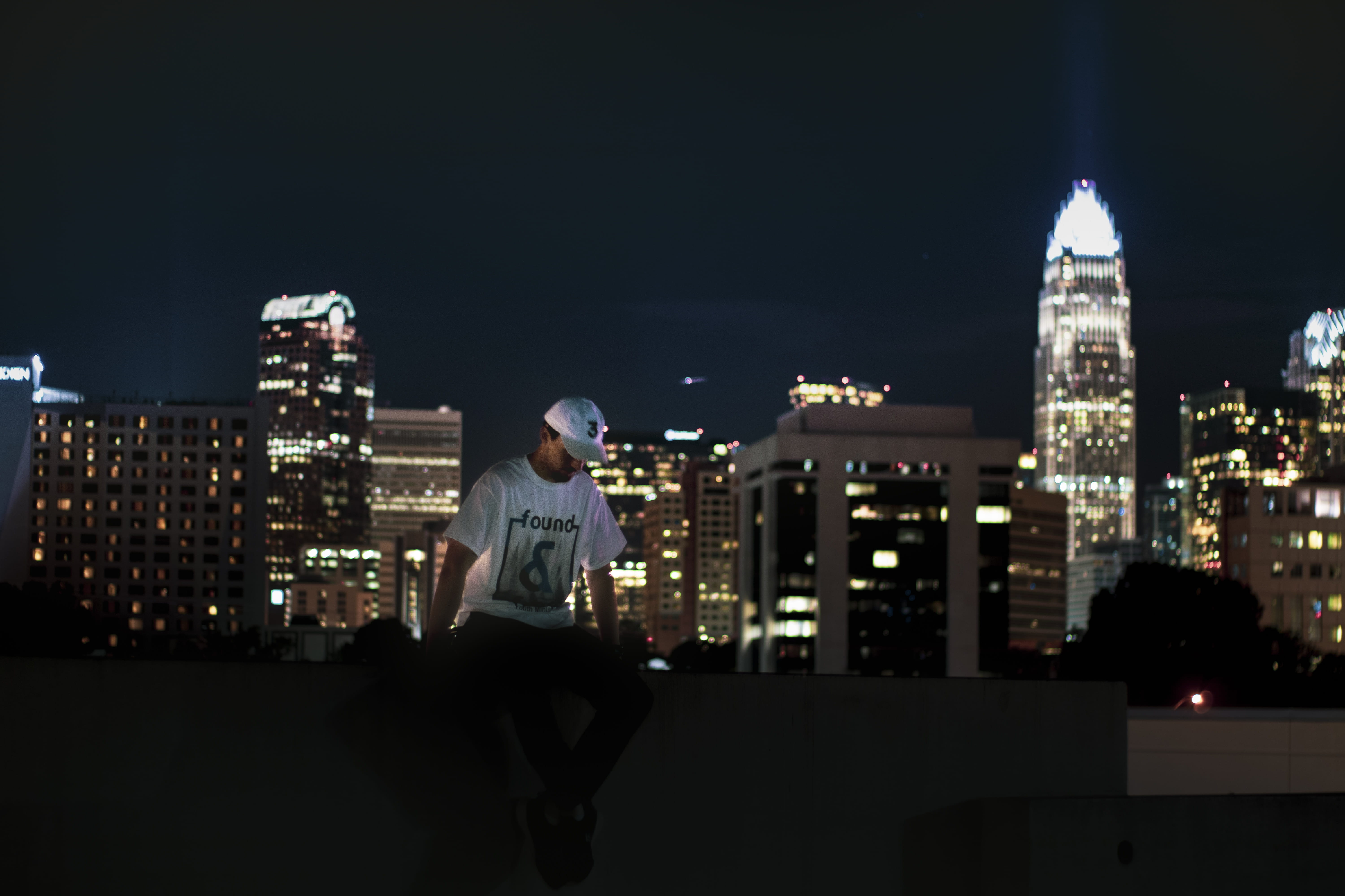 city life, high rise, sport, urban skyline, night, skyscraper, architecture, young adult, sitting, person, city, urban, modern, time, standing, downtown, HD Wallpaper