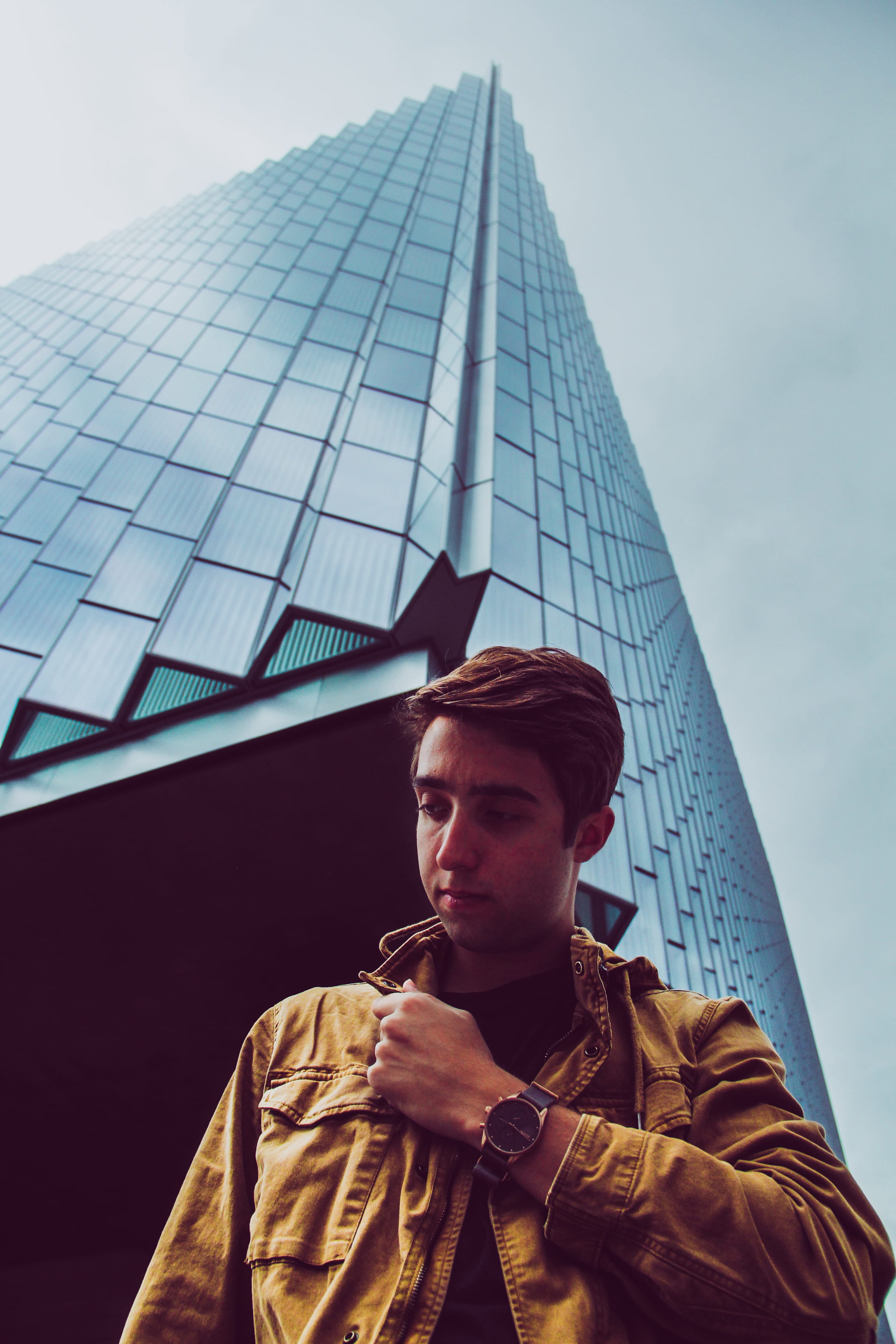 lifestyles, built structure, warm clothing, daytime, real people, portrait, front, looking away, standing, architecture, one person, young men, 2K, building, Phone HD Wallpaper
