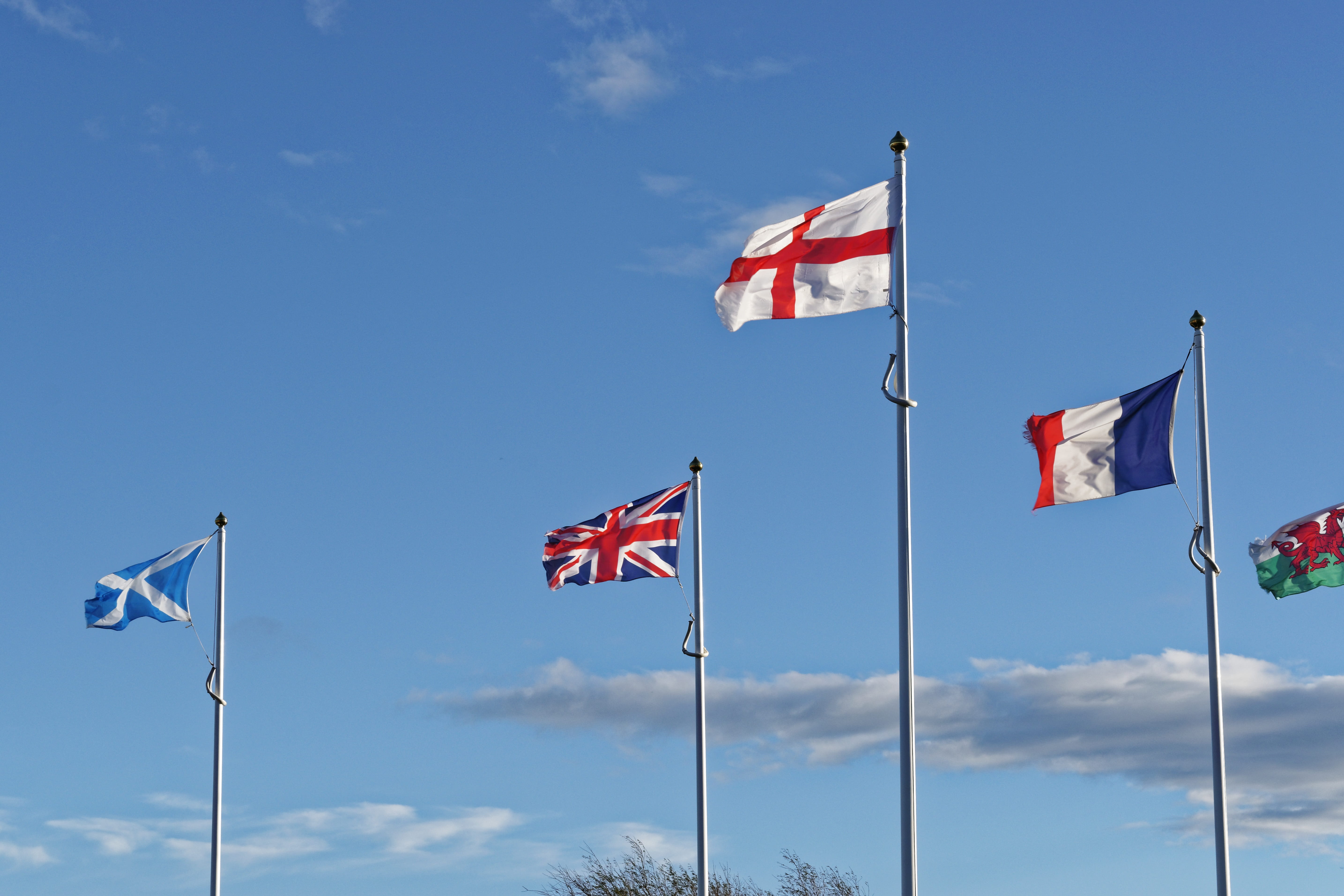 flags flapping, Union, british, independence, britain, wales, blue, national icon, cloud - sky, Flags, sky, 5K, low angle view, union, outdoors, patriotism, HD Wallpaper