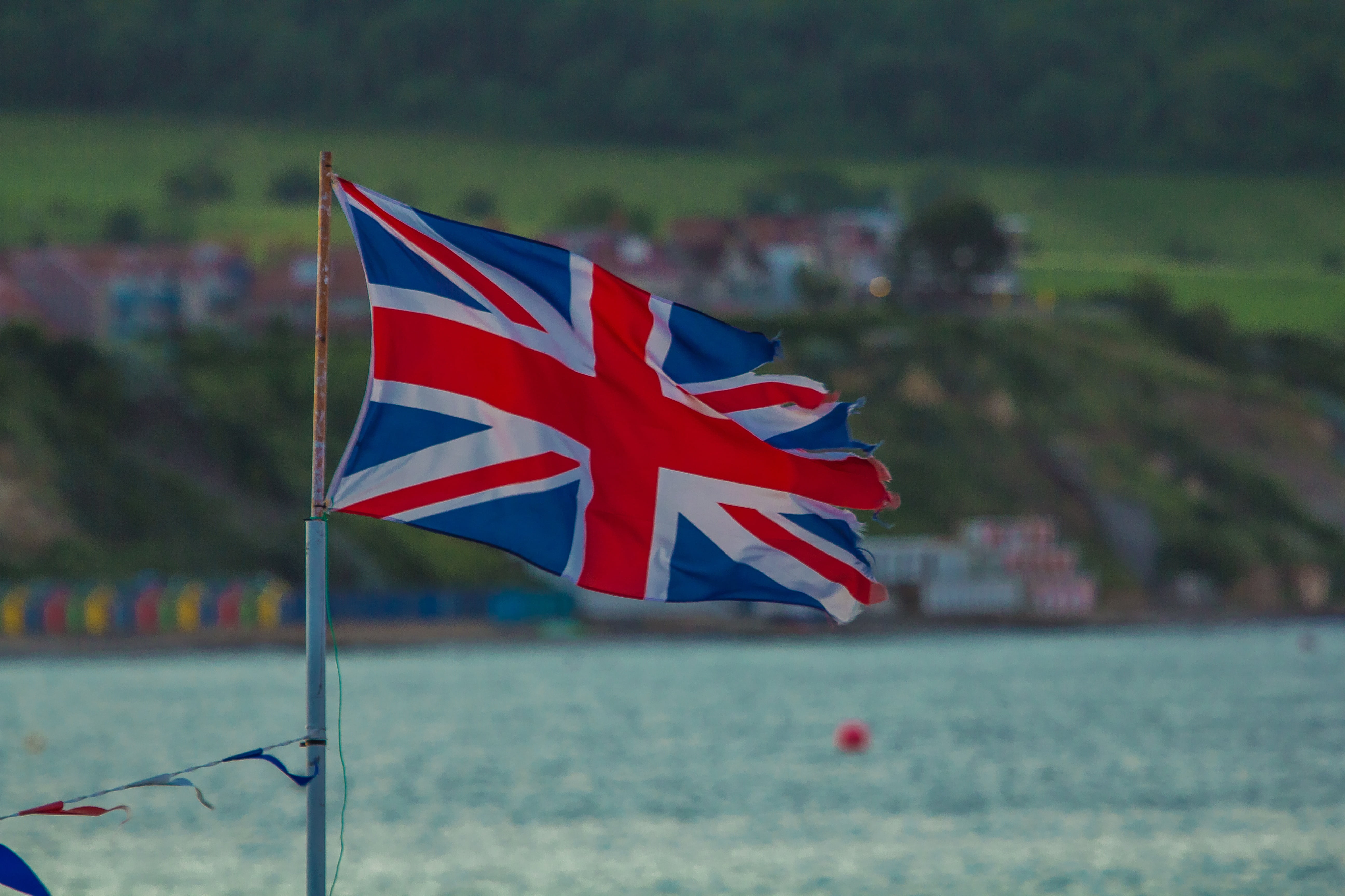 wind, 5K, emotion, independence, national icon, river, patriotism, torn, water, union jack, red, flag, outdoors, waterfront, nature, day, no people, pride, HD Wallpaper
