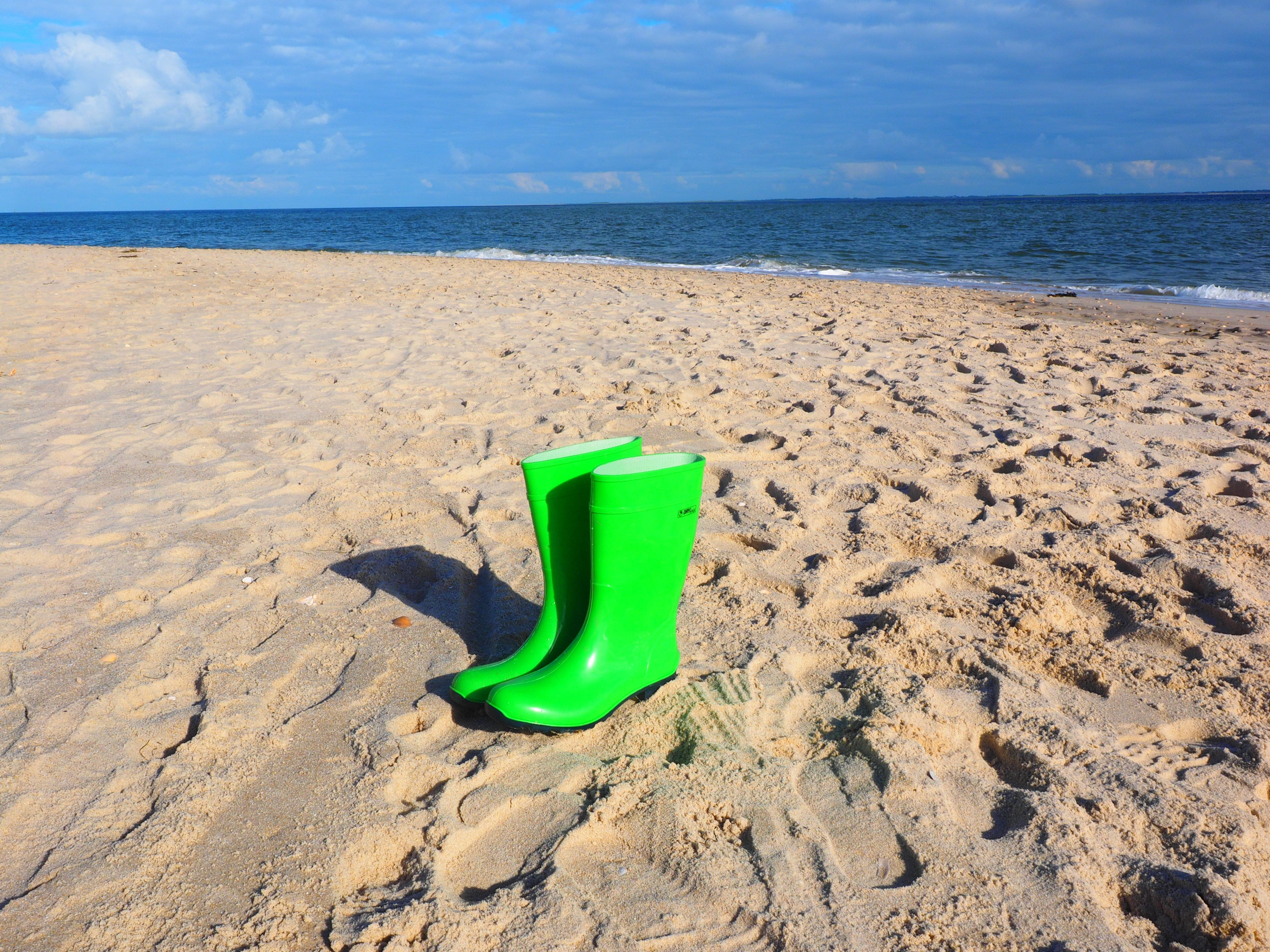 green color, sunlight, sea, inflatable, no people, rain shoes, water, day, sand, shoes, shovel, tranquility, beauty in nature, beach, green, horizon, outdoors, HD Wallpaper