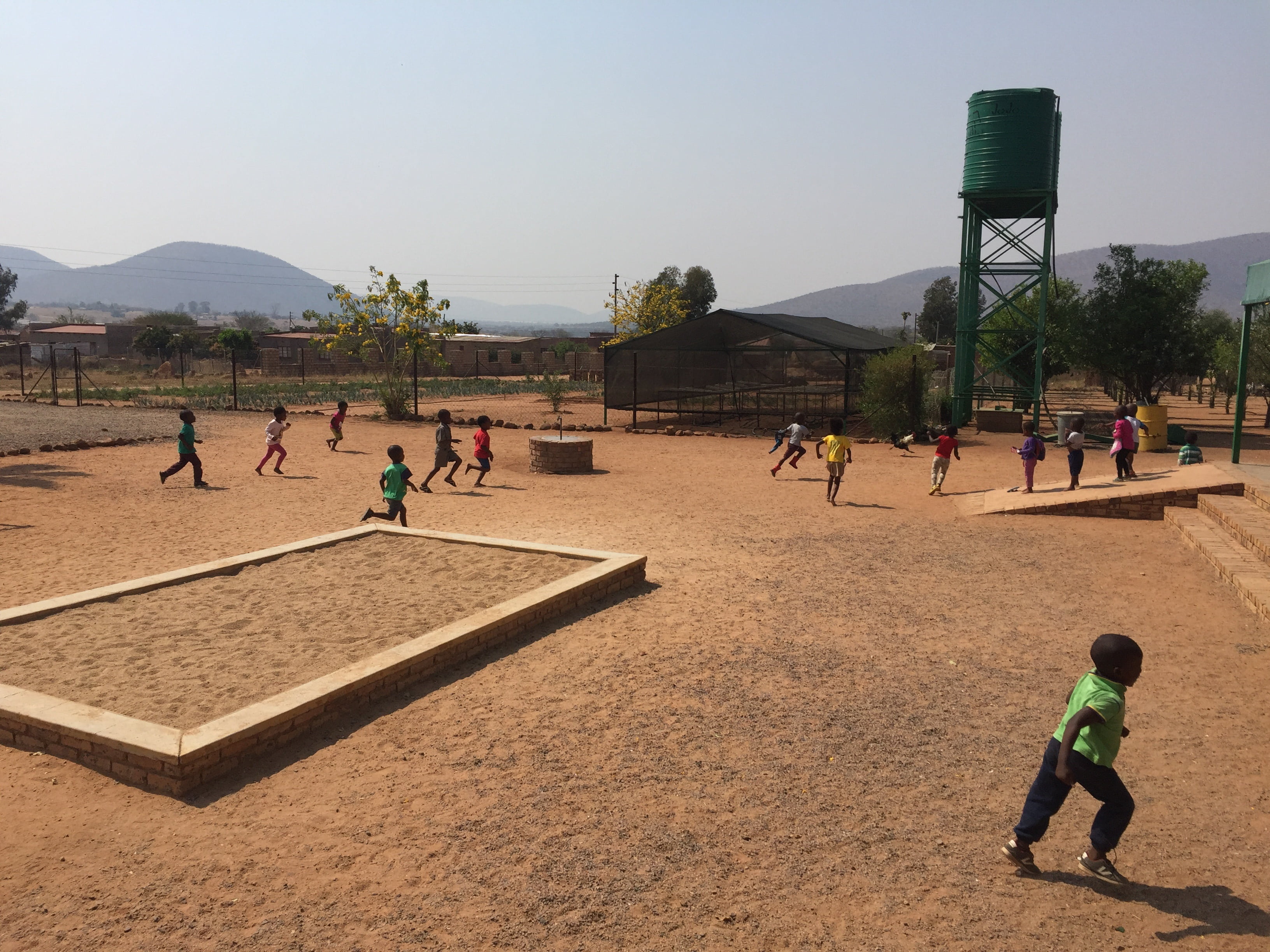 voluntary engagement, mountains, children, training, land, childhood, frond, dusty, sky, real people, clear sky, people, school, day, water tank, nursery school, HD Wallpaper