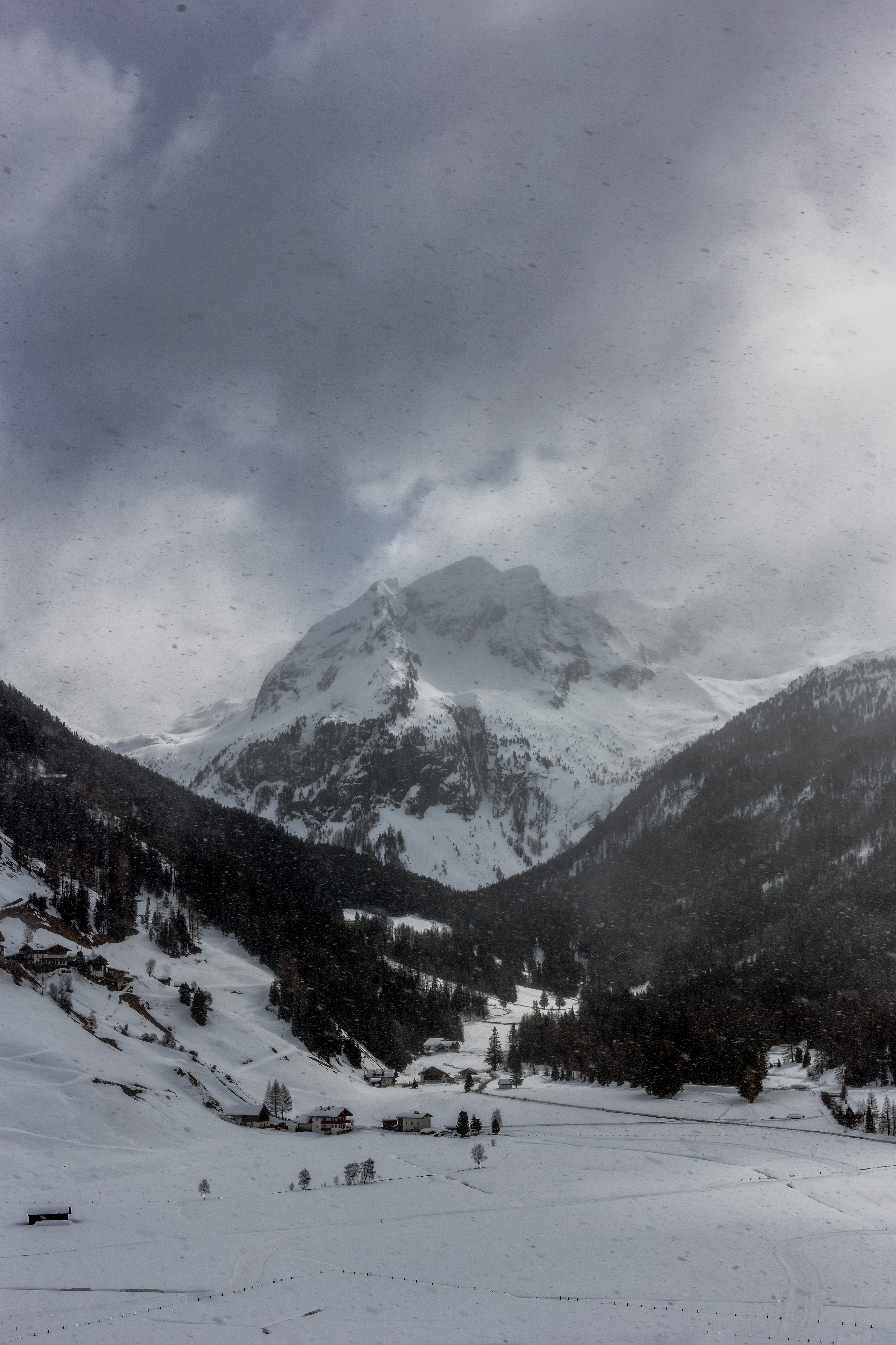 range, covering, cold, 5K, cloud - sky, near, scenics - nature, wilderness, grayscale, clouds, no people, dark, storm, mountain peak, capped, peak, snowcapped mountain, Phone HD Wallpaper