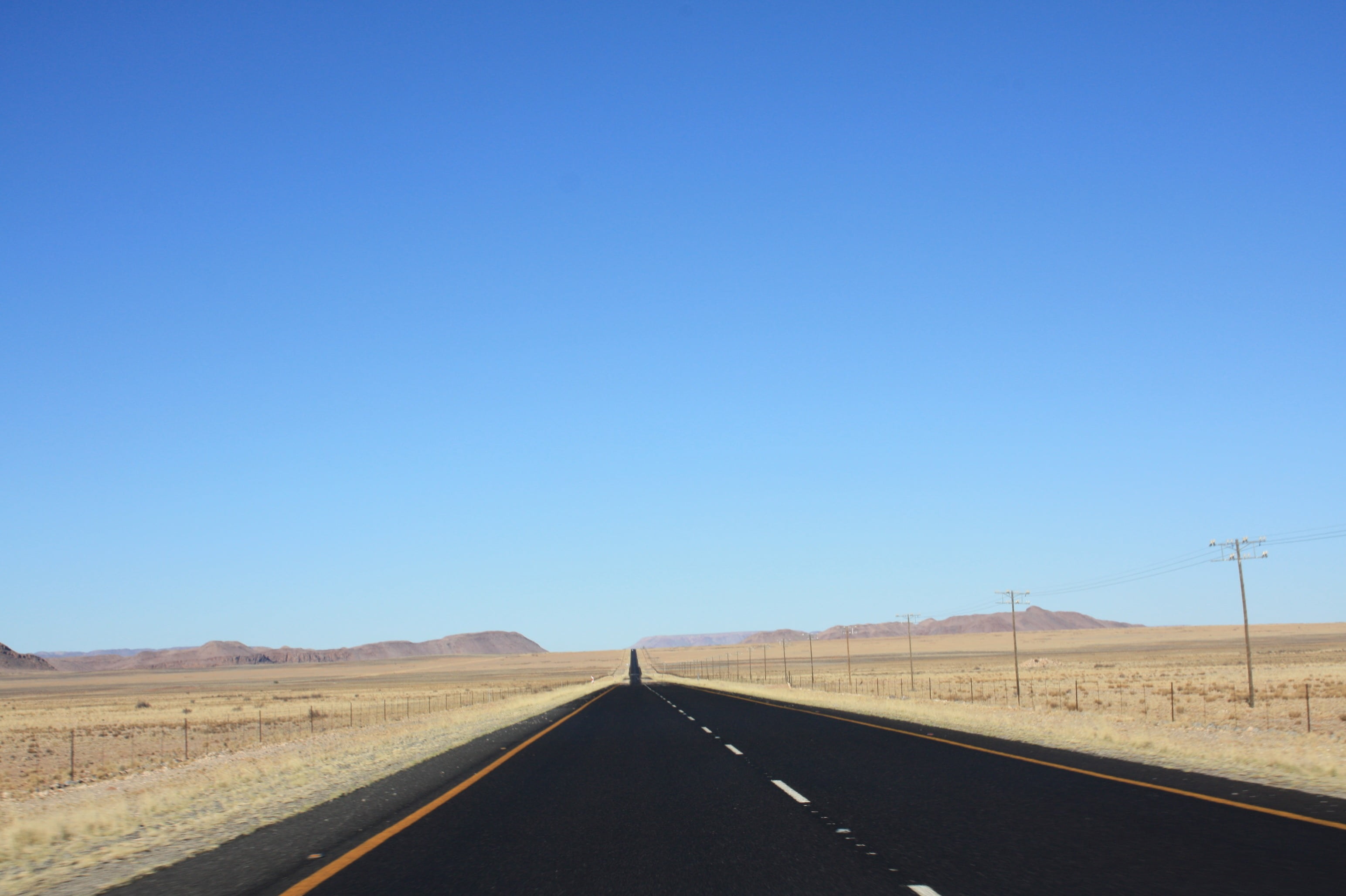 2K, semi-arid, horizon, no people, country, diminishing perspective, environment, outdoors, clear sky, sign, straight, endless, uSA, transportation, highway, HD Wallpaper