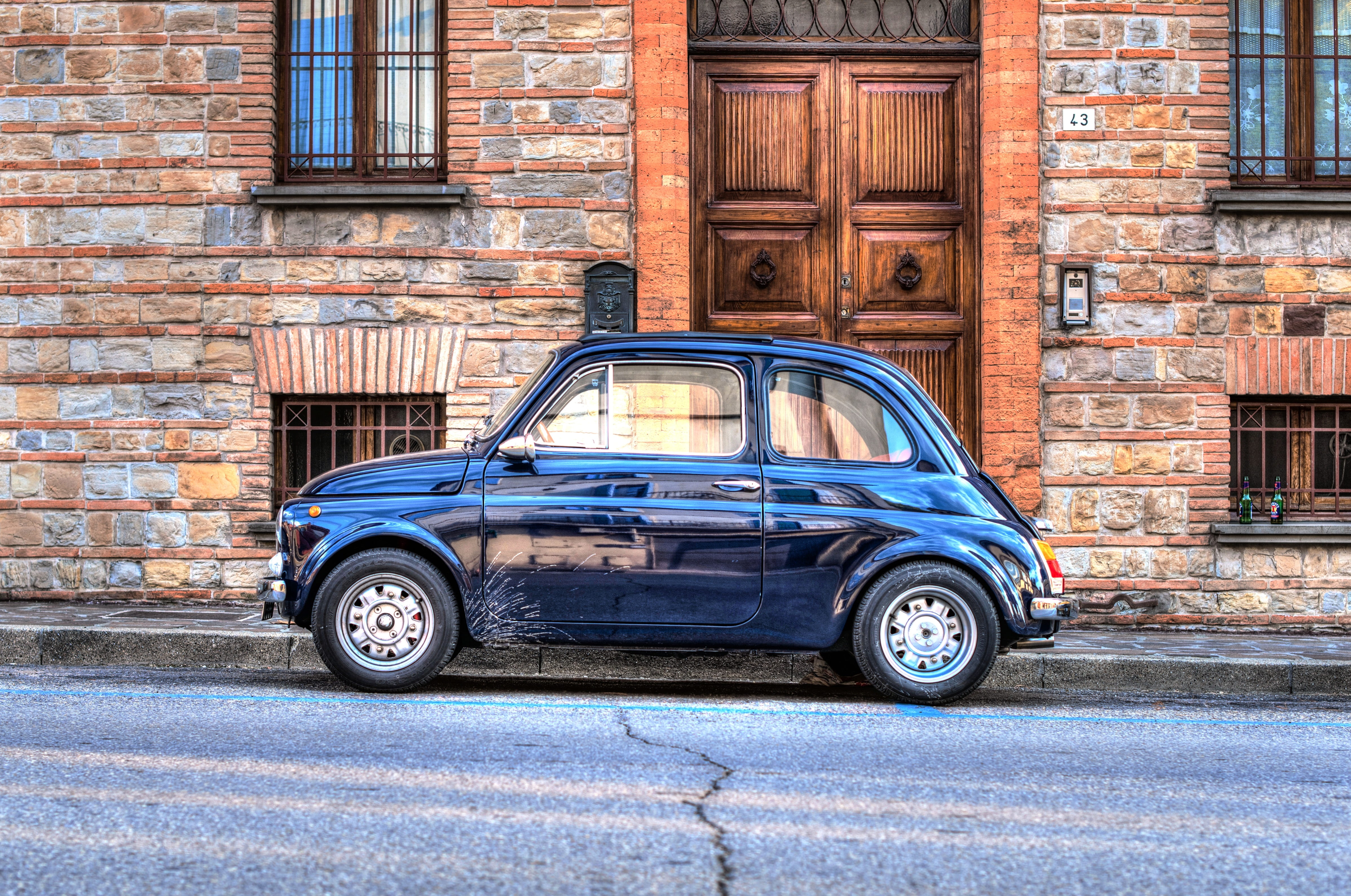 mode of transportation, door, car, brick, 4K, near, travel, antique, transportation, brown, transport, city, mini, roadside, wall, hdr, bricked, parked, HD Wallpaper