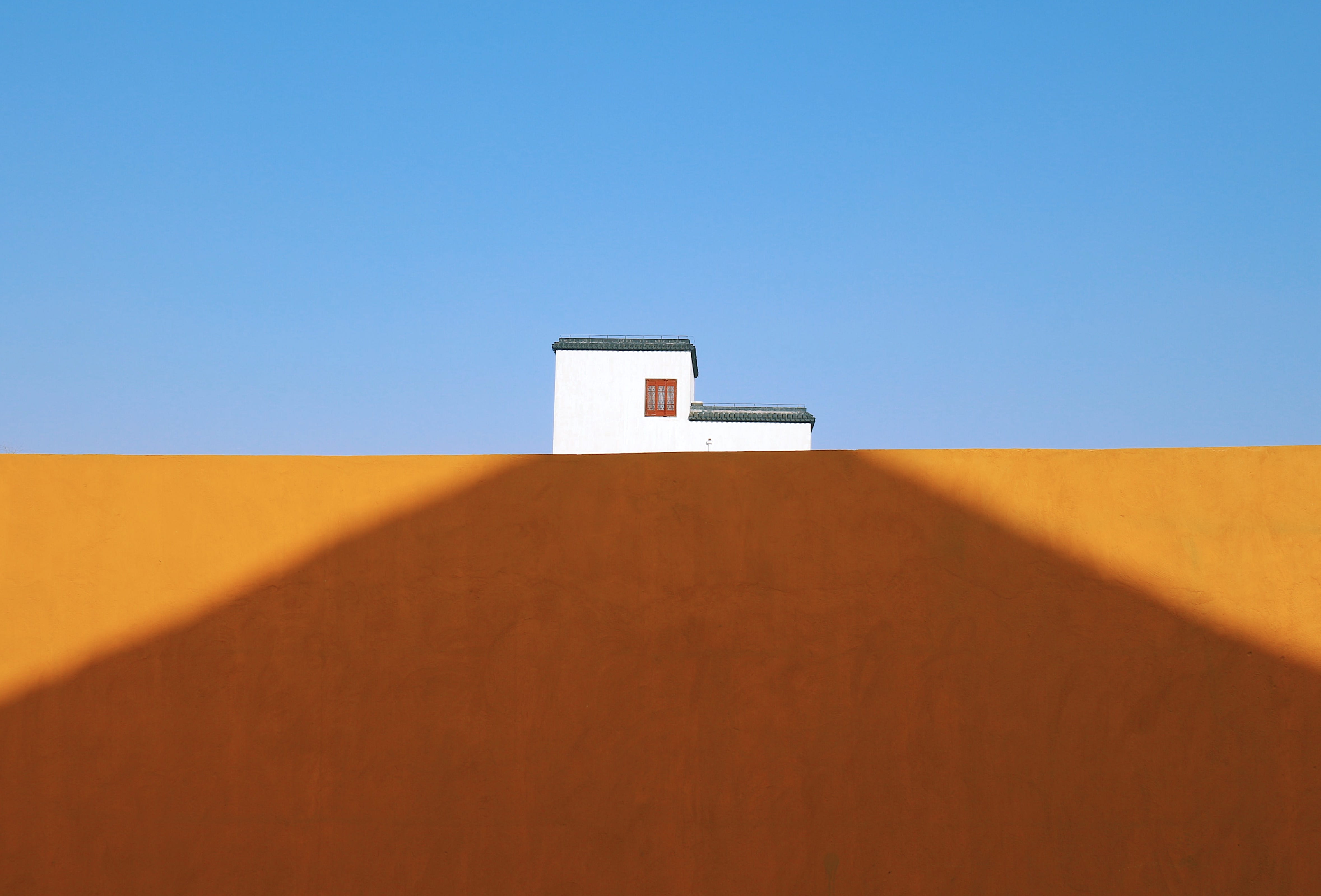 concrete, shadow, brown, desert, soil, architecture, clear sky, blue, house, sunlight, home, wall - building feature, climate, sky, building exterior, nature, HD Wallpaper