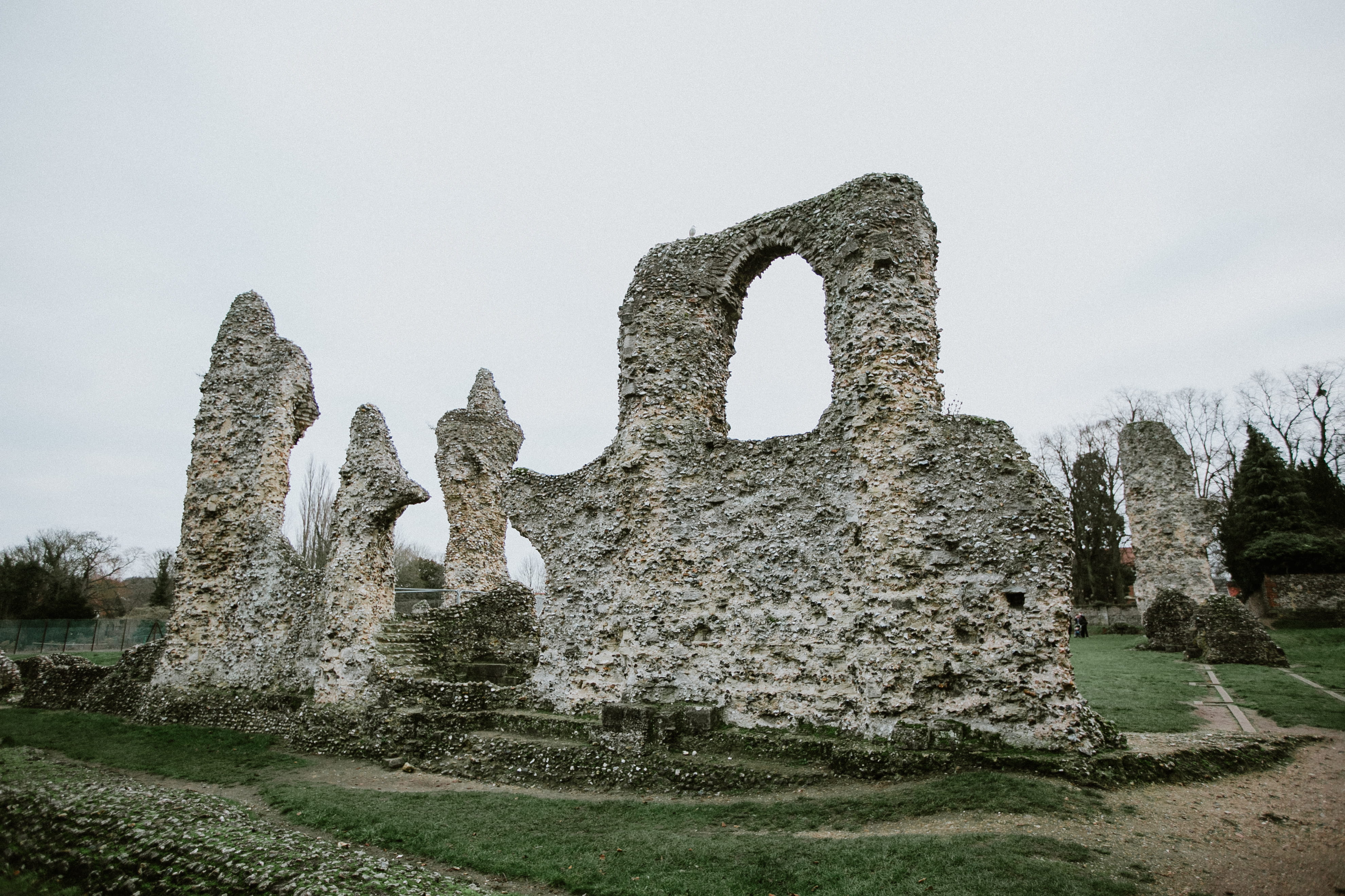 church, solid, sky, rock - object, grass, day, built structure, nature, arch, creativity, triangle, broken, plant, field, archaeology, bury, no people, HD Wallpaper