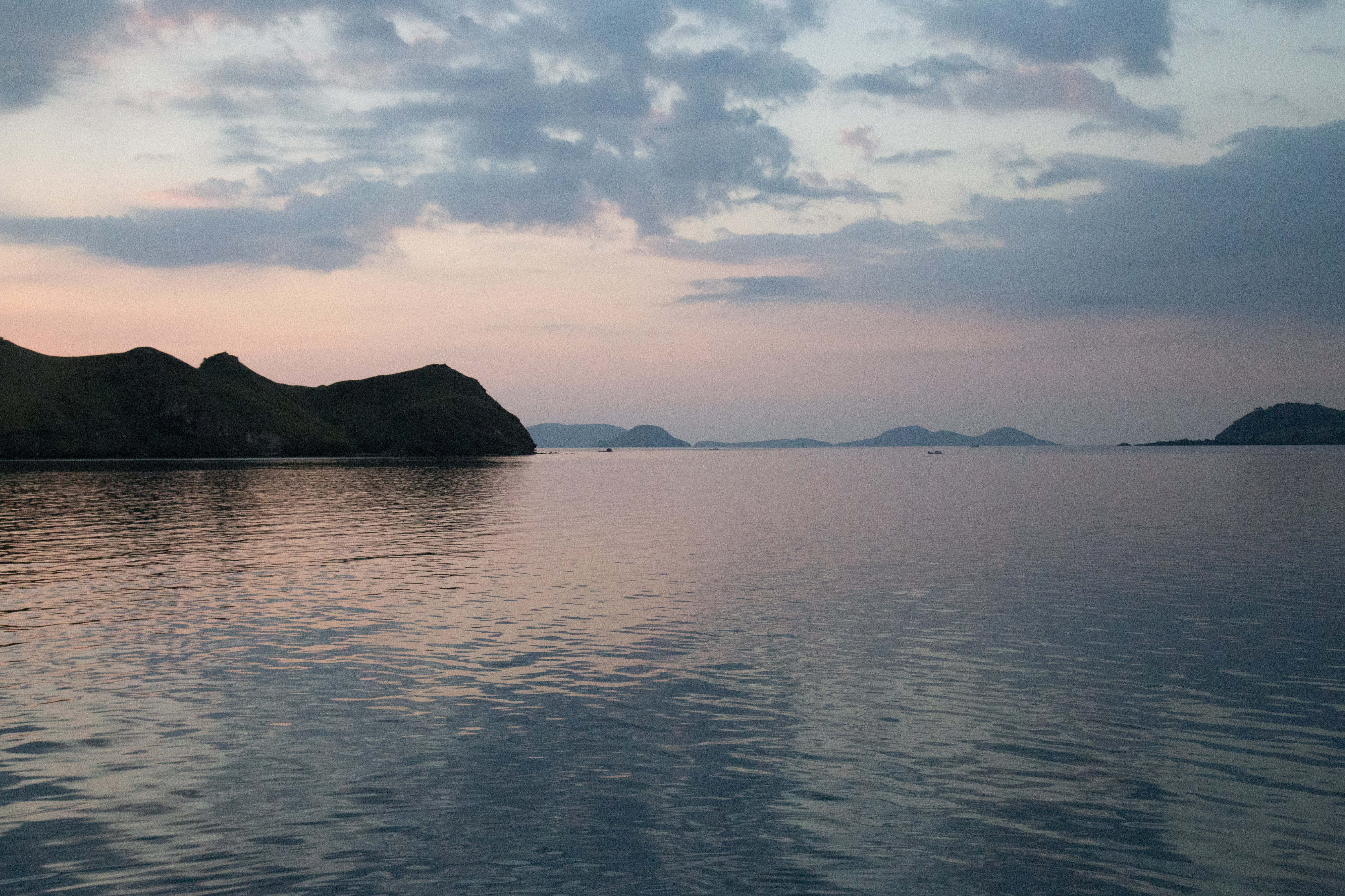 no people, mountain, national park, mountain range, day, sky, rippled, beauty in nature, outdoors, reflection, waterfront, komodo national park, komodo, HD Wallpaper