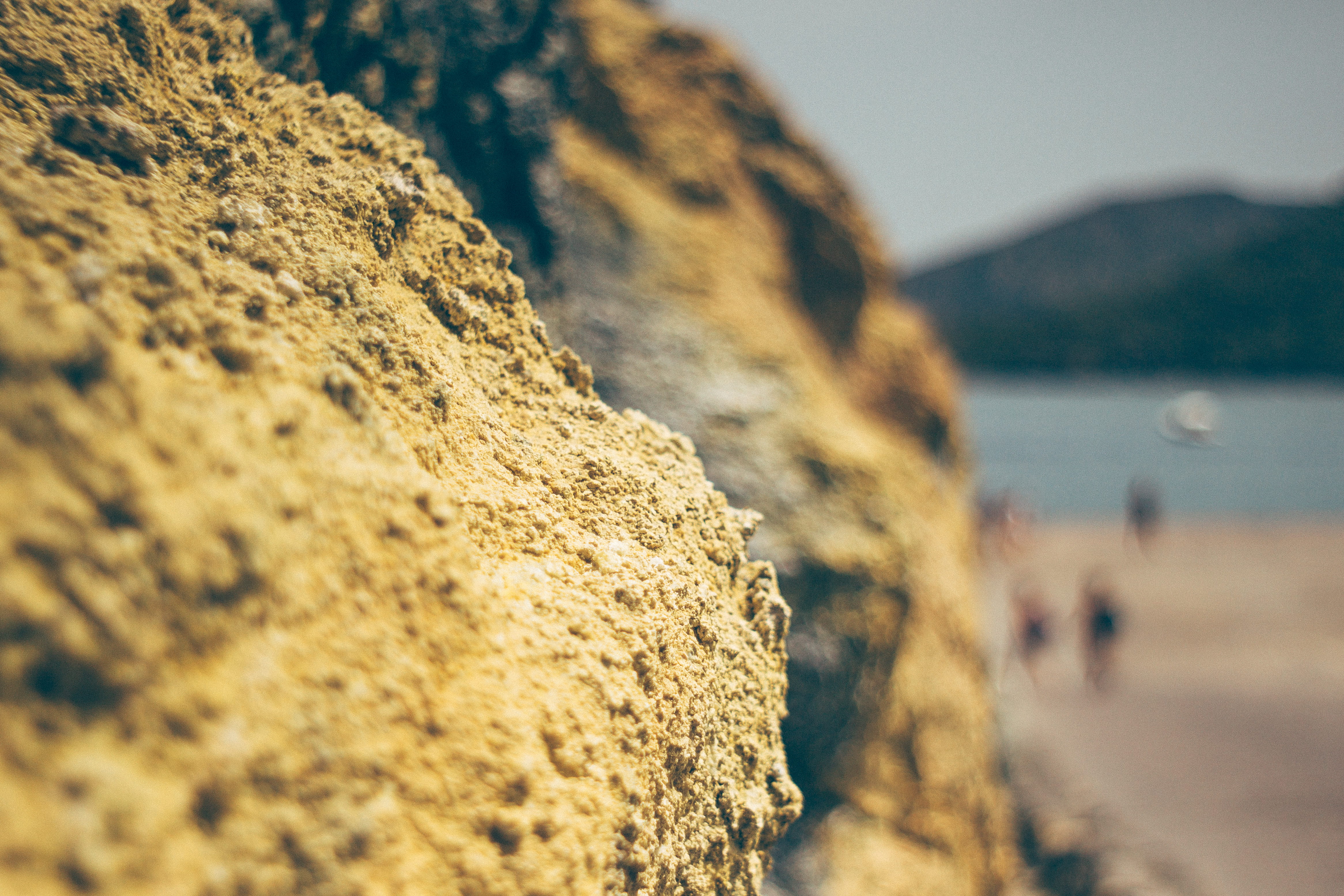selective focus, no people, 4K, water, beach, sulfur, outdoors, rock, sea, rock - object, sicily, rough, mountain, textured, solid, focus on foreground, HD Wallpaper