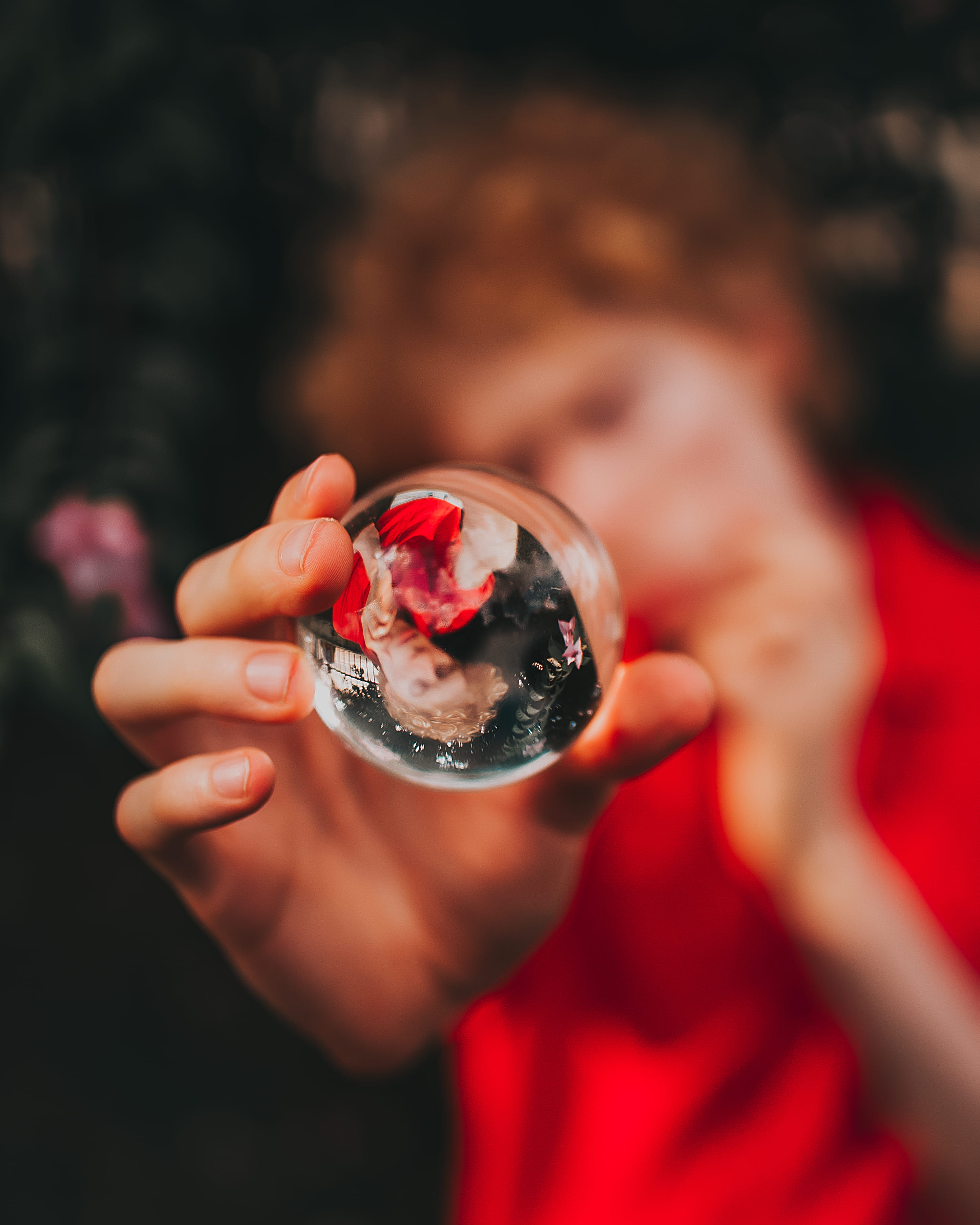hand, macro, ball, body part, focus on foreground, focus, selective, childhood, fruit, 2K, real people, lifestyles, glass, human body part, Lensball, holding, Phone HD Wallpaper