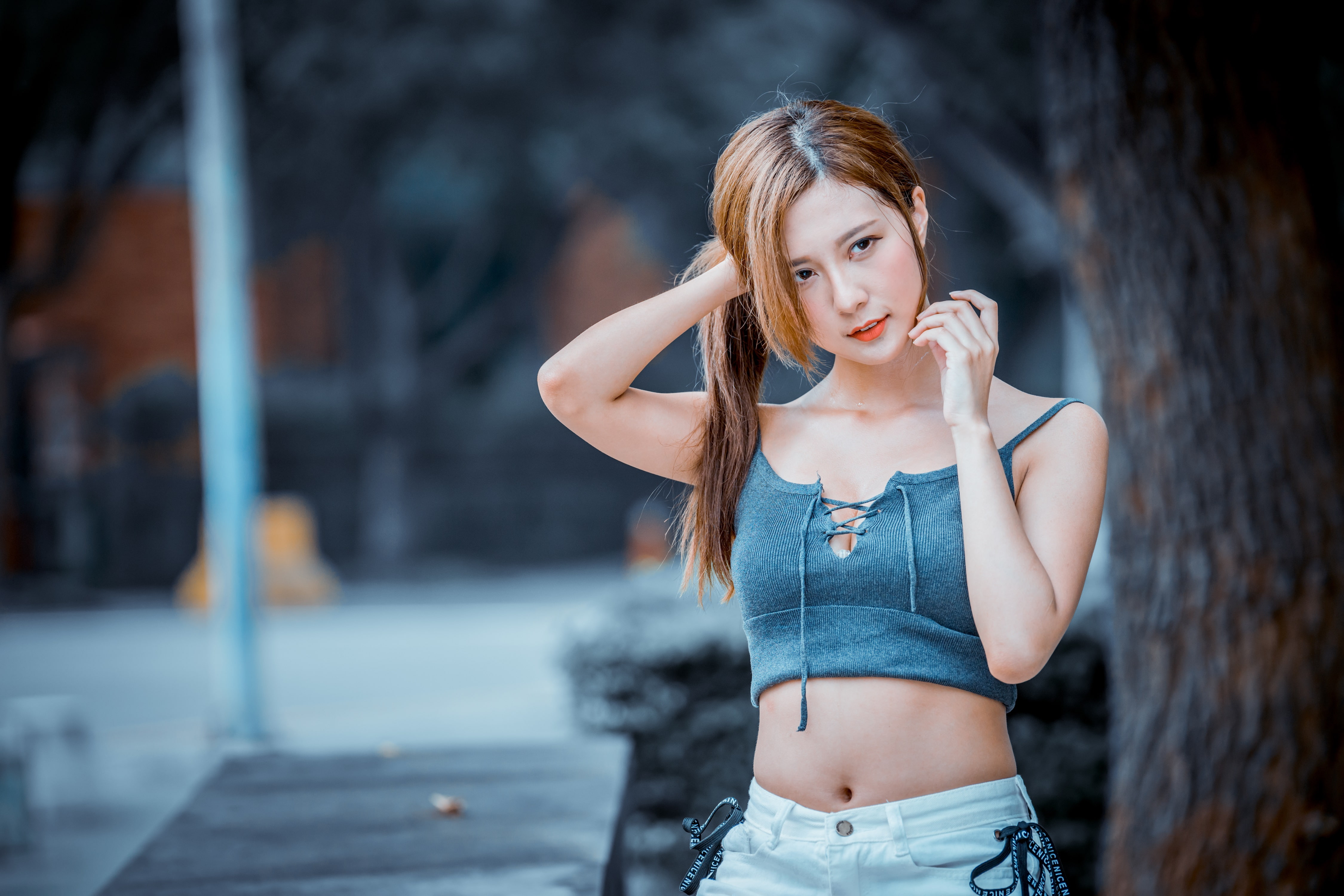 brunette, women outdoors, selective coloring, women, belly, depth of field, short tops, trees, Asian, outdoors, portrait, 4K, holding hair, looking away, HD Wallpaper