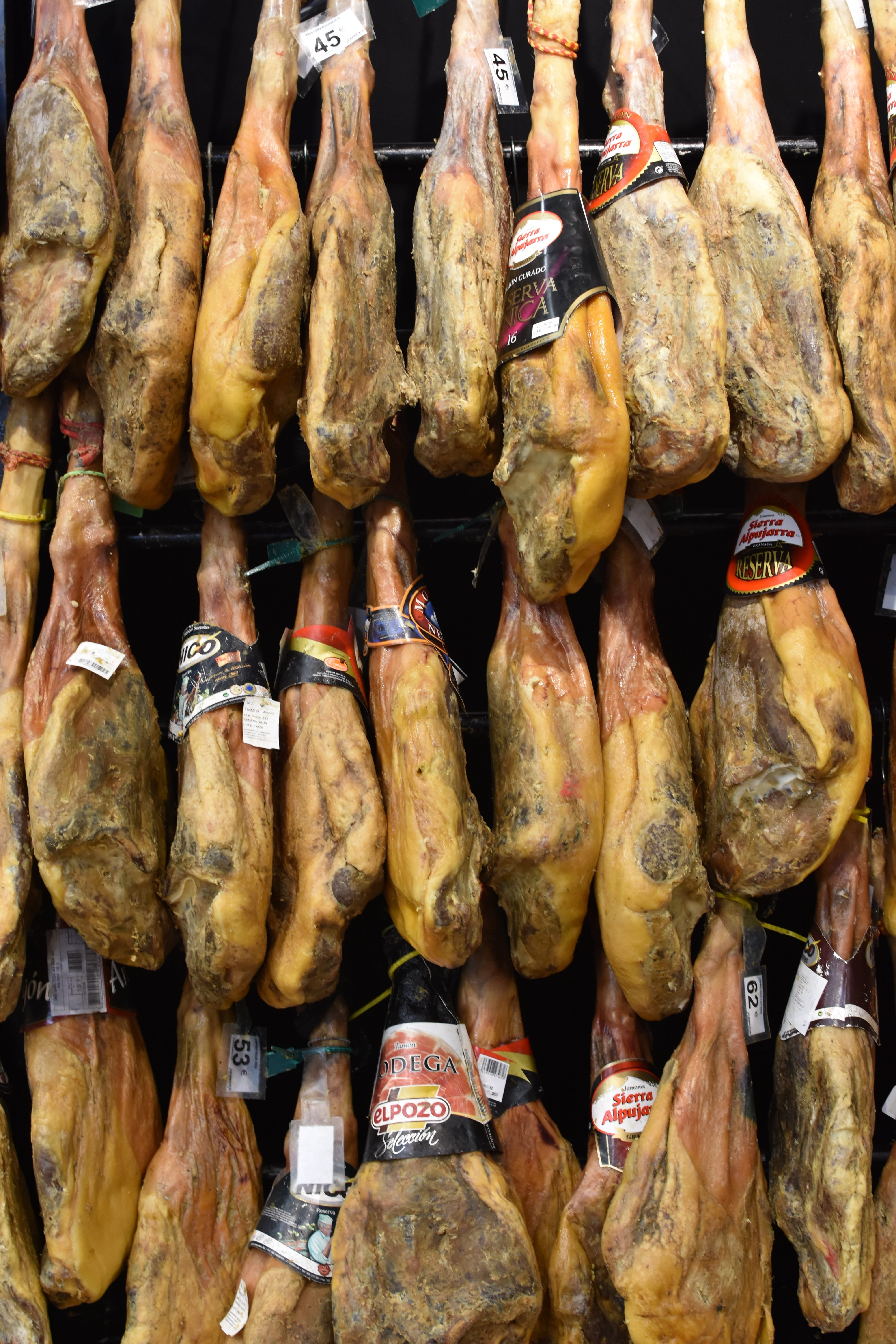 large group of objects, pata negra, freshness, retail display, food and drink, day, serrano ham, small business, retail, dried meat, abundance, market stall, Phone HD Wallpaper