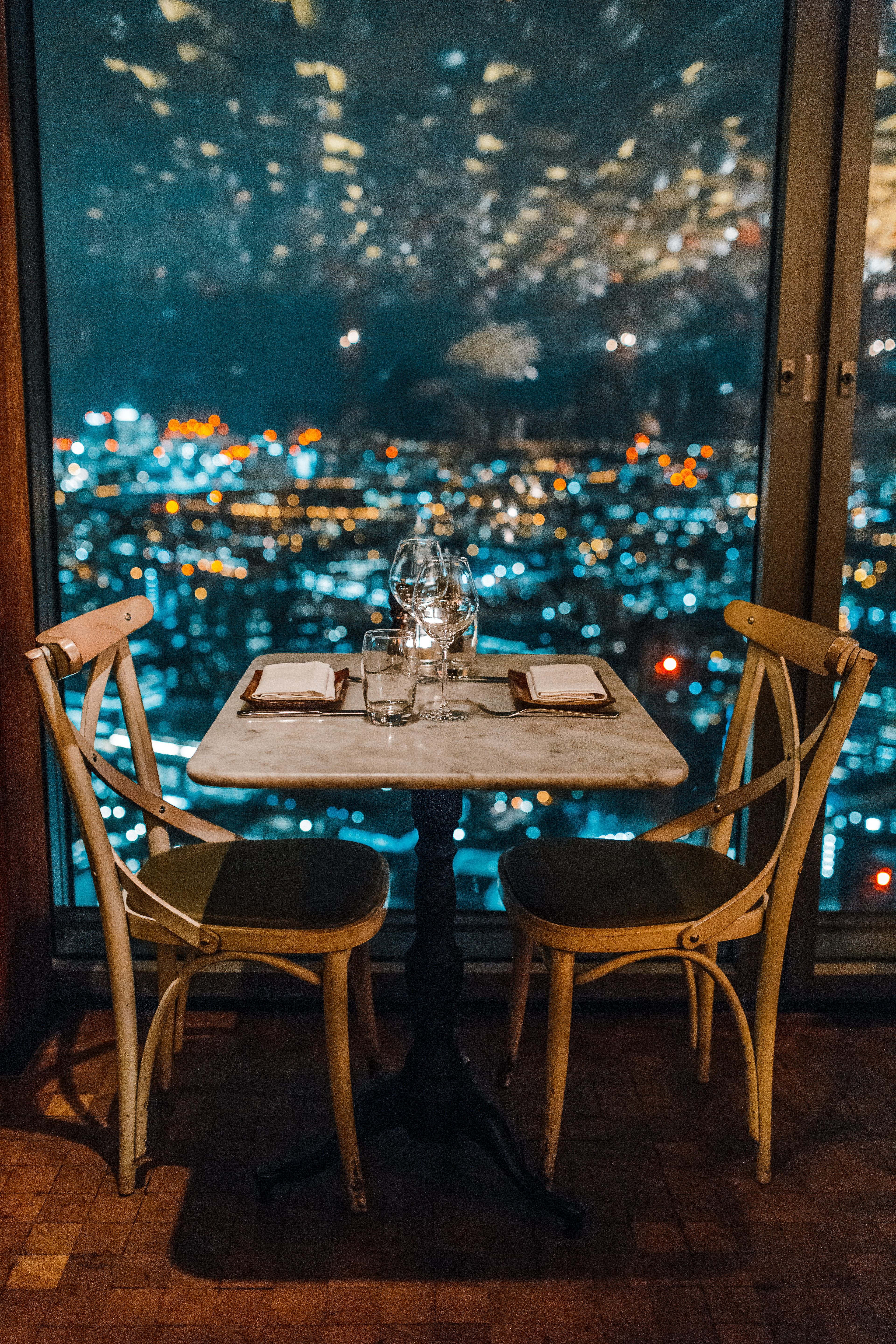 business, cityscape, wood - material, gray, two, setting, arrangement, glass - material, transparent, dinner, window, indoors, chair, decoration, lights, Phone HD Wallpaper