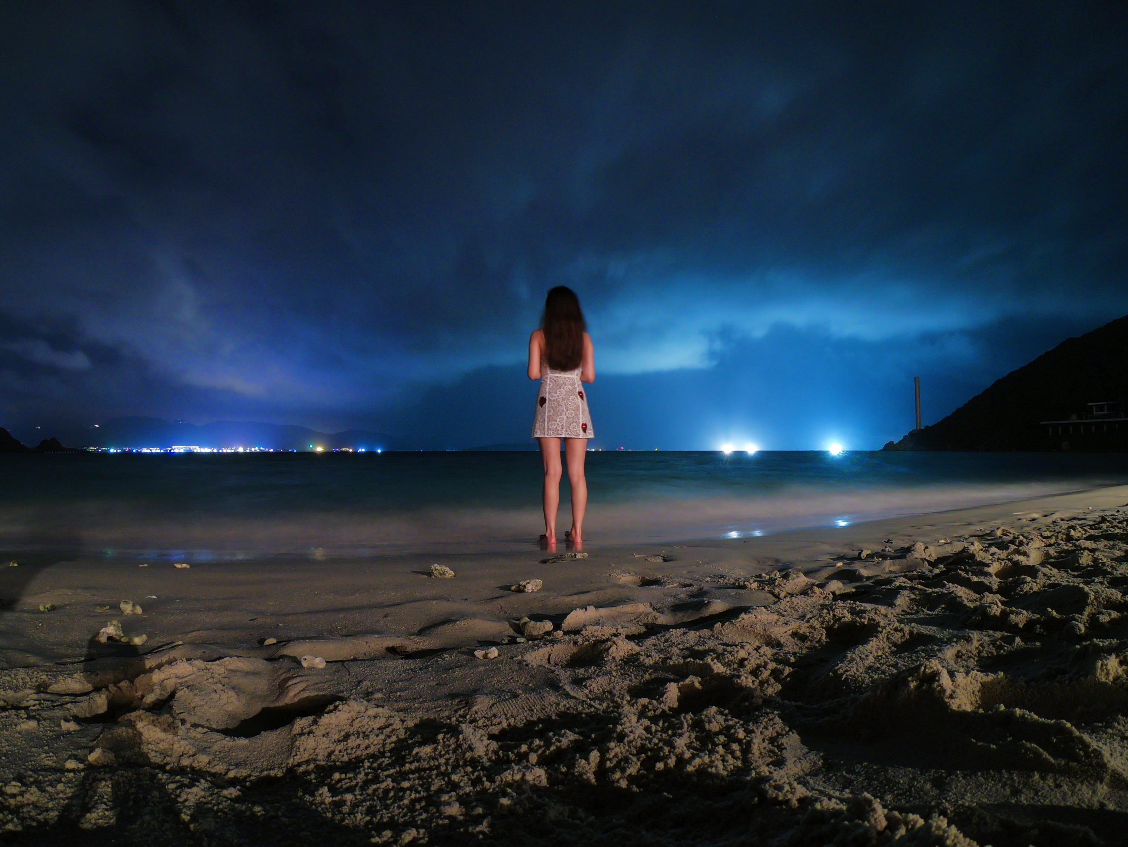 shoreline, human, ocean, solid, shorts, rock, coast, sky, full length, soil, nature, cloud - sky, illuminated, one person, rock - object, dirt road, flare, HD Wallpaper