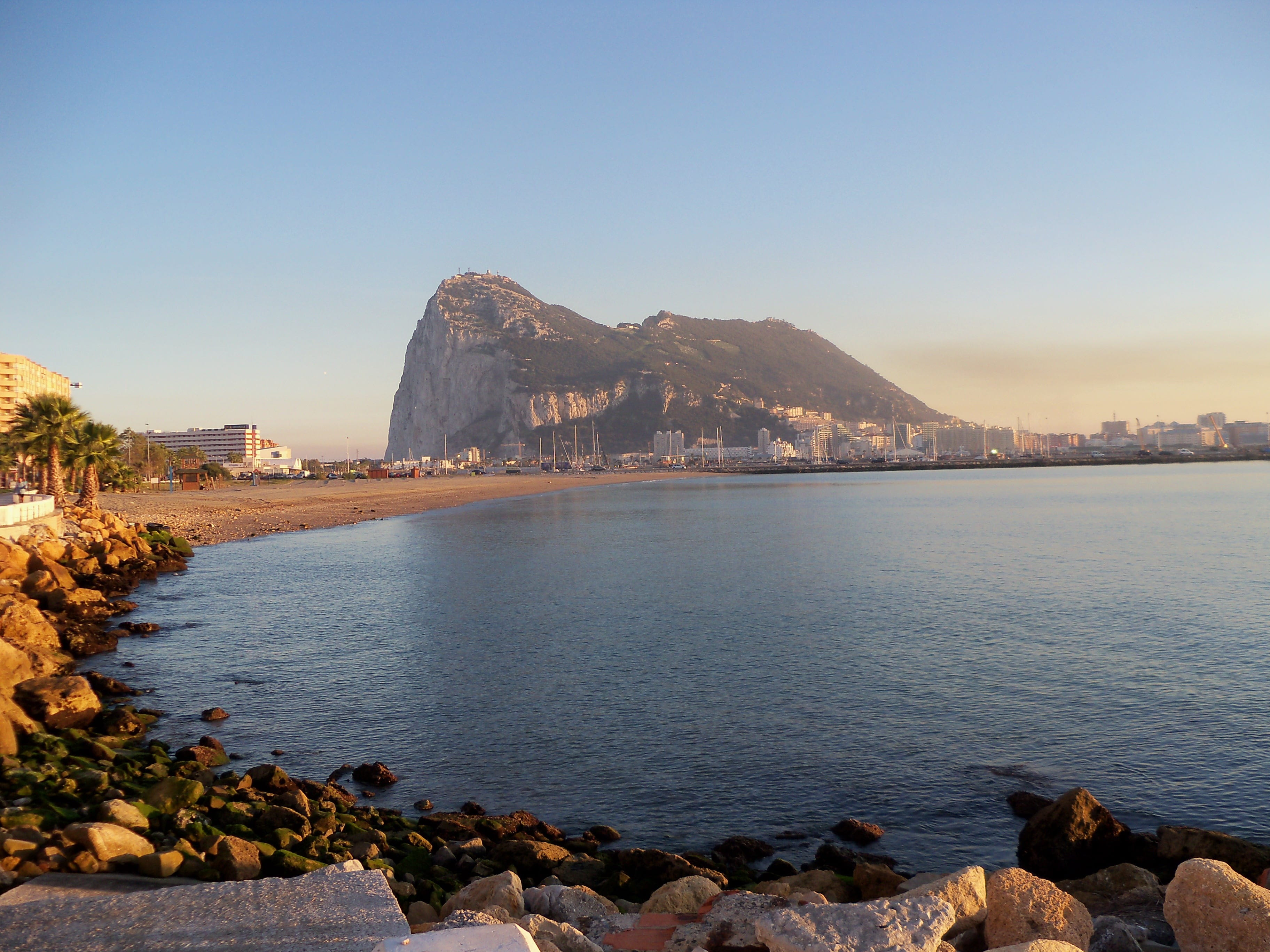 body, no people, beach, calm, Spain, scenics - nature, Algeciras, reflection, shore, Gibraltar, 2K, rock - object, land, clear sky, mountain, tranquility, HD Wallpaper