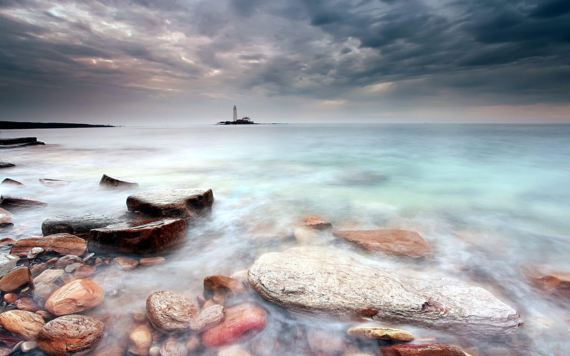 brown, blue, calm, stones, gray, black, sea, lighthouse, sky, 1080P, stormy, 1920x1200, rock, cloud, nature, HD Wallpaper