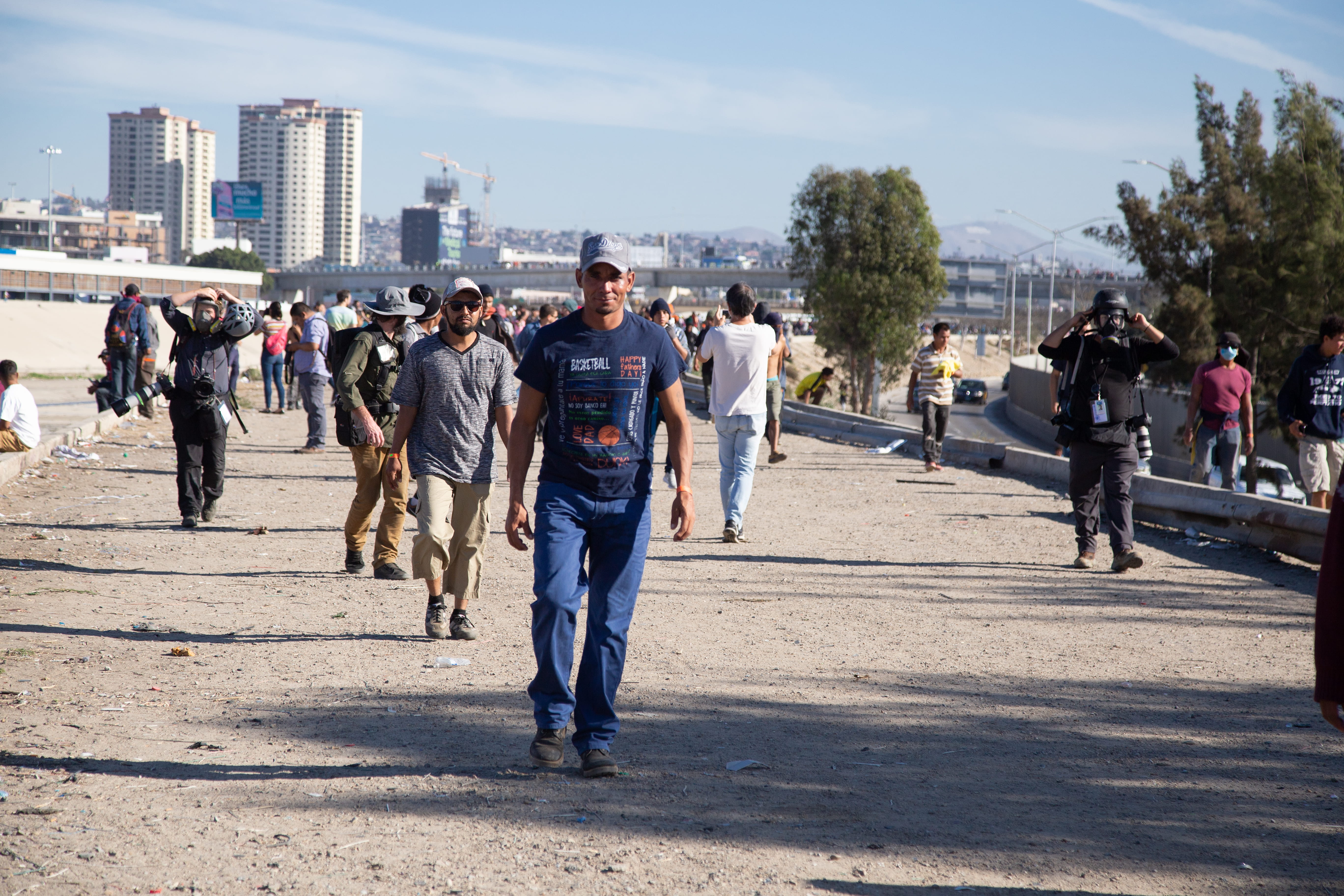 crowd, hondureños, tijuana, sunlight, rear view, building exterior, walking, uniform, people, shadow, baja california, leisure activity, men, large group of people, HD Wallpaper