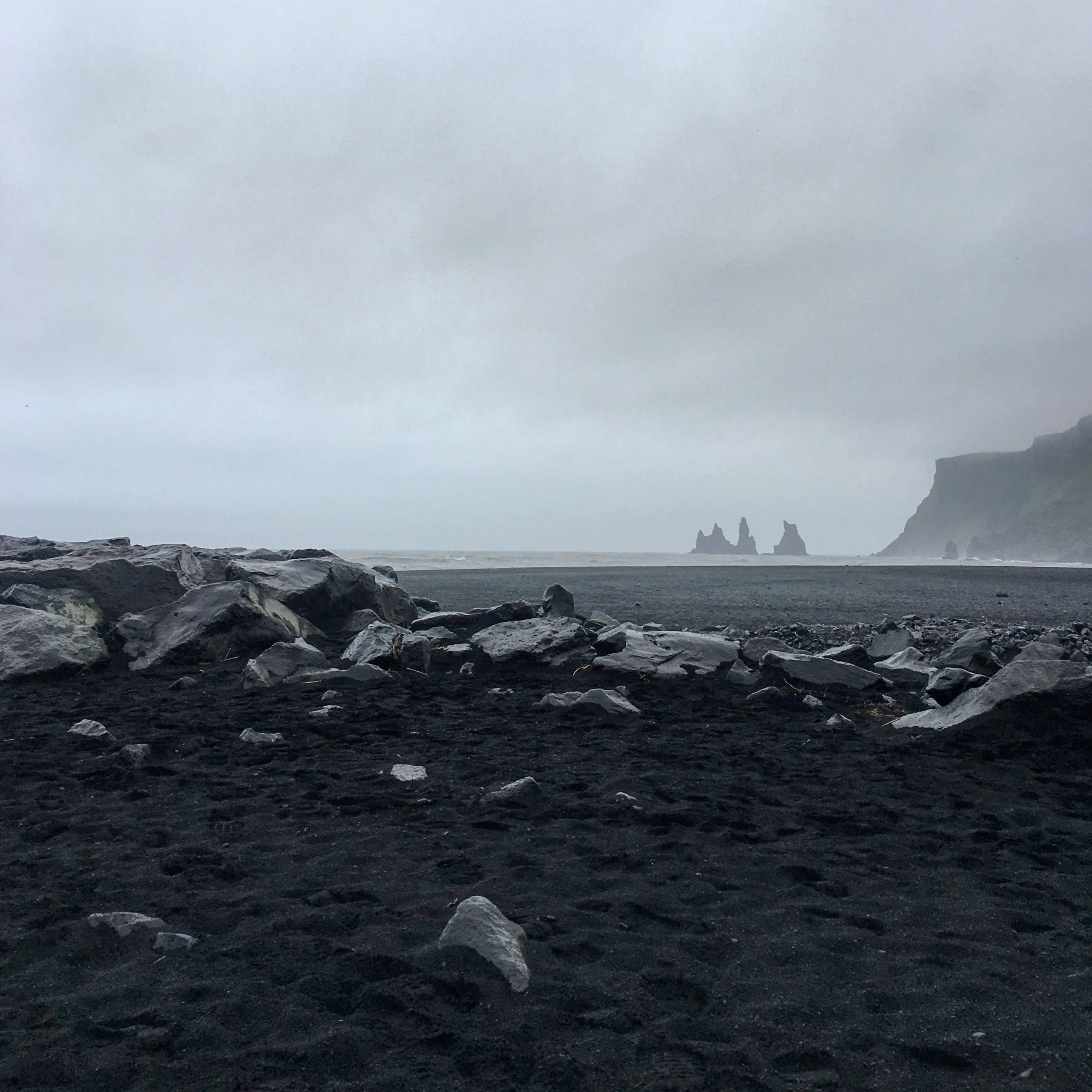 rock - object, vik, tranquil scene, solid, sea, black sand, beauty in nature, outdoors, mountains, non-urban scene, black beach, cloud - sky, 2K, pollution, Phone HD Wallpaper