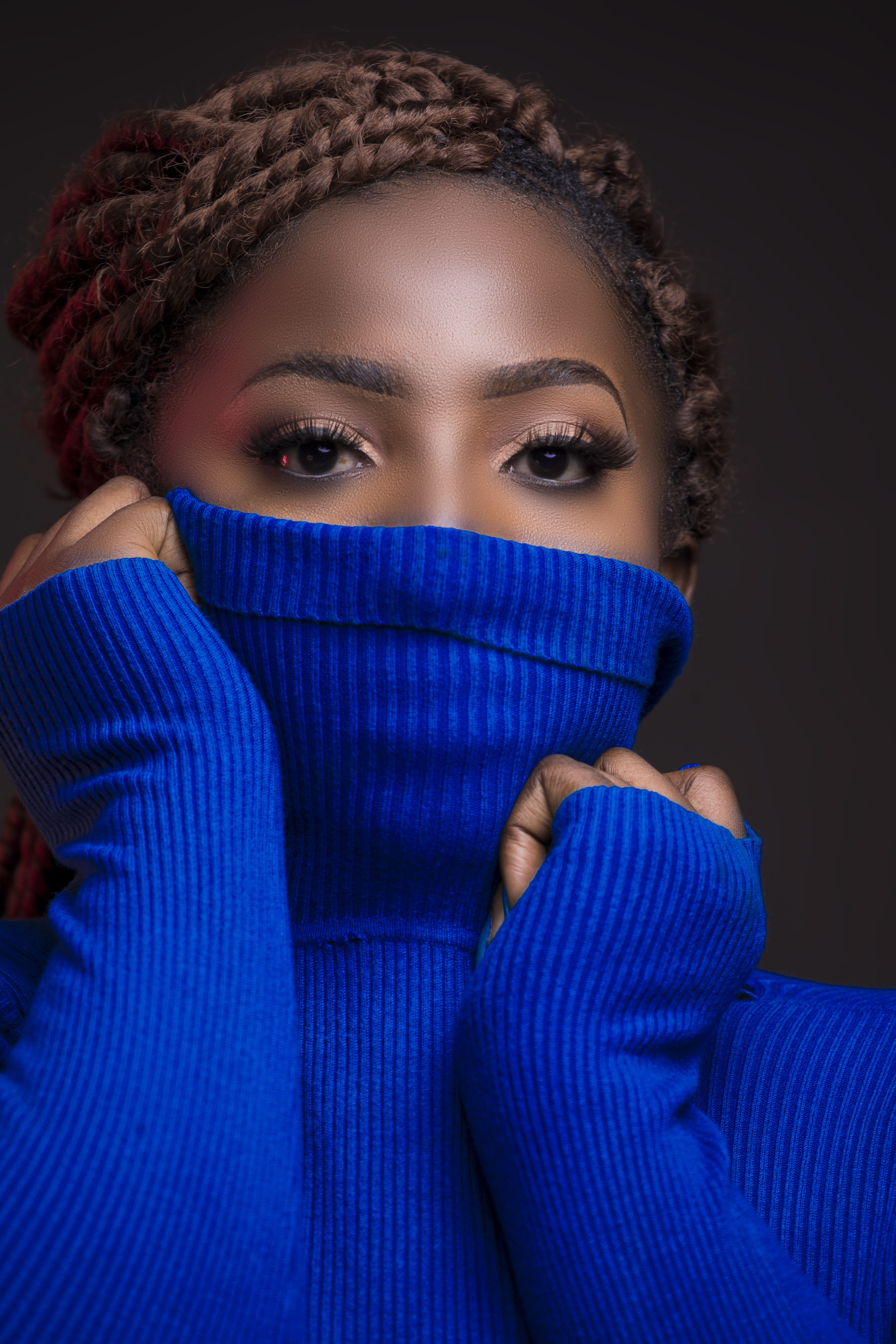 black background, front view, covering, longsleeves, hiding, one person, human face, looking at camera, woman, beautiful, close-up, blue, adult, headshot, Phone HD Wallpaper