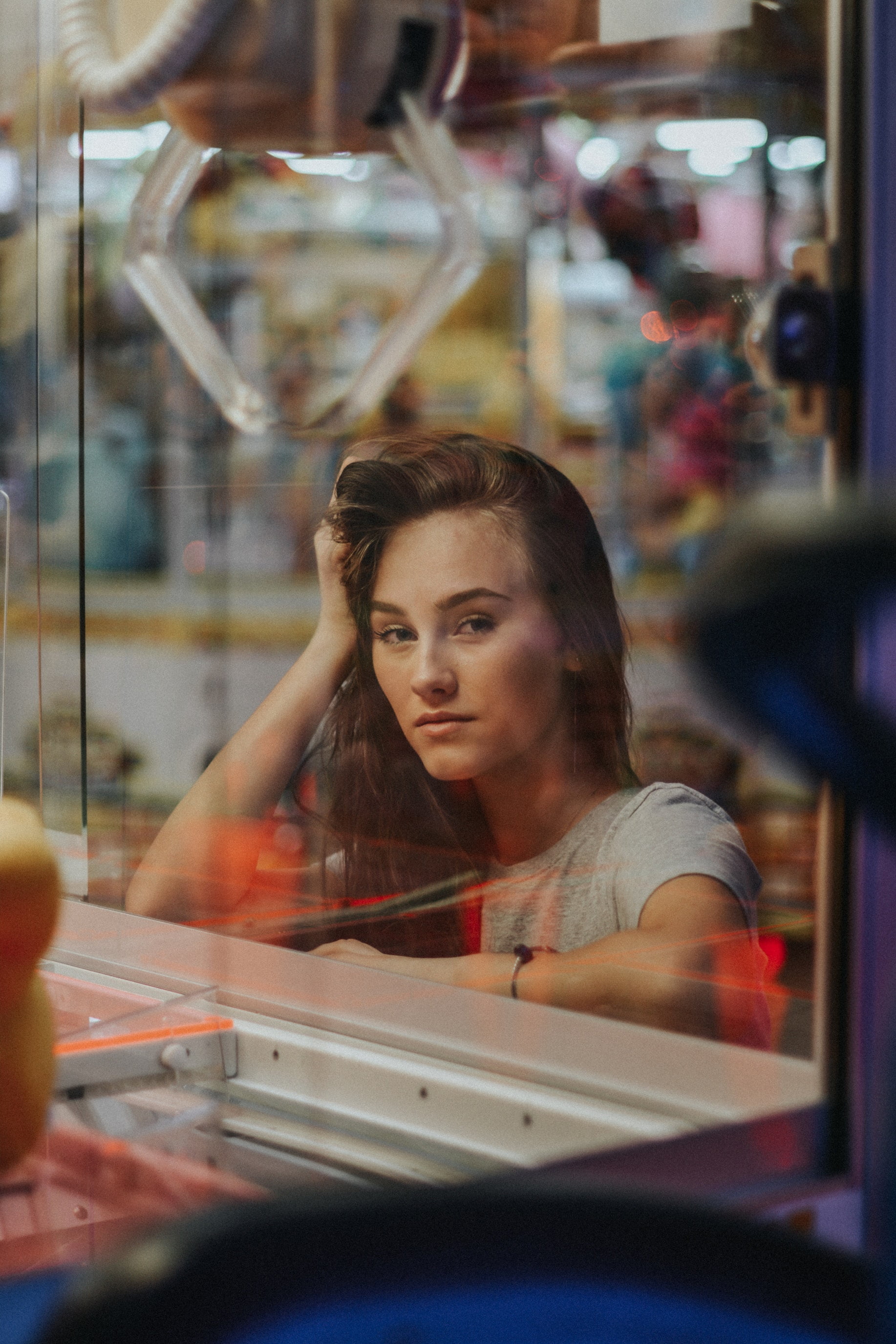 city, reflection, adult, looking at viewer, motion, window, one person, headshot, retail, portrait, brunette, young adult, store, looking, glass - material, Phone HD Wallpaper
