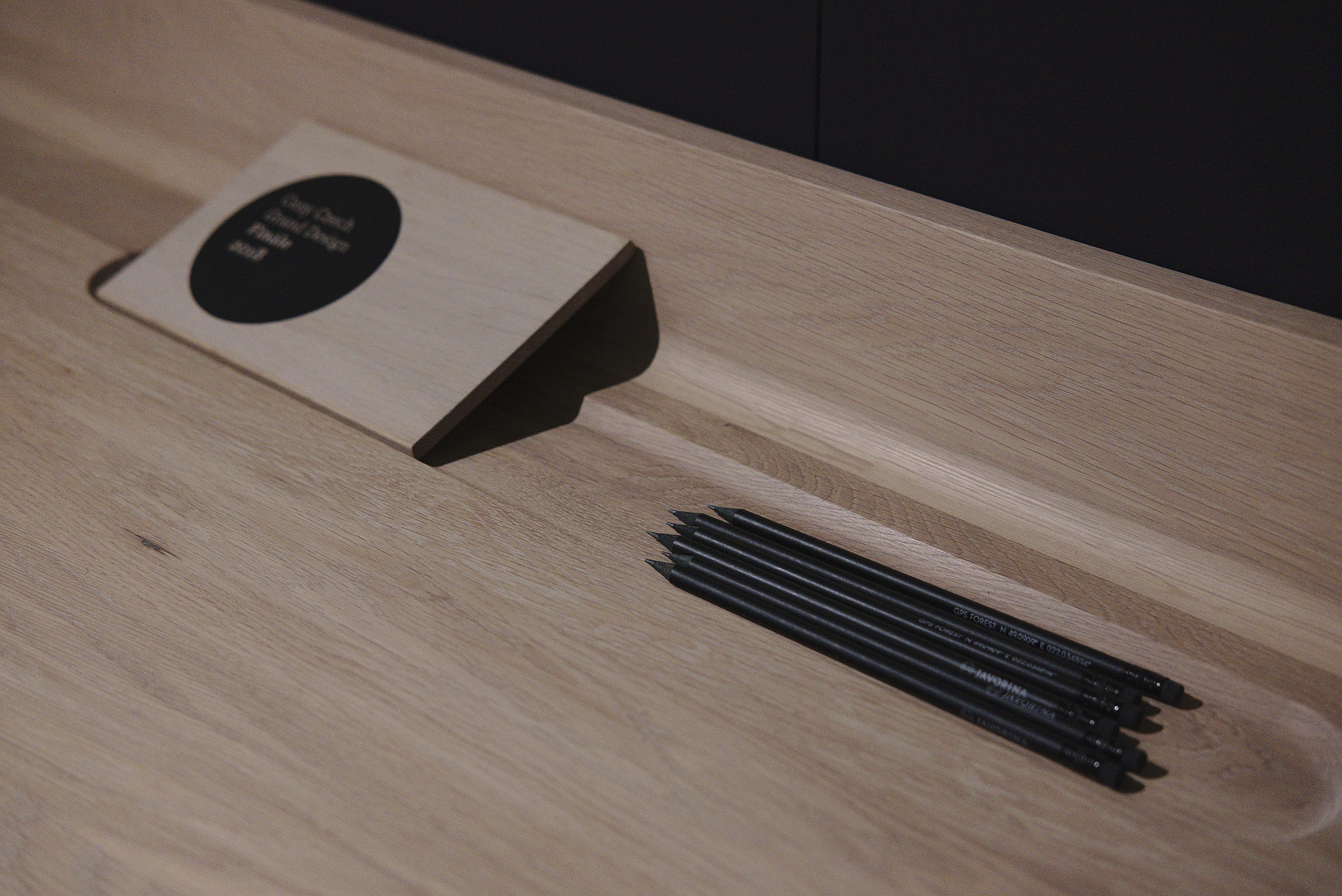 wood - material, black color, flooring, text, indoors, focus on foreground, case, shape, circle, still life, close-up, 4K, table, arts culture and entertainment, HD Wallpaper