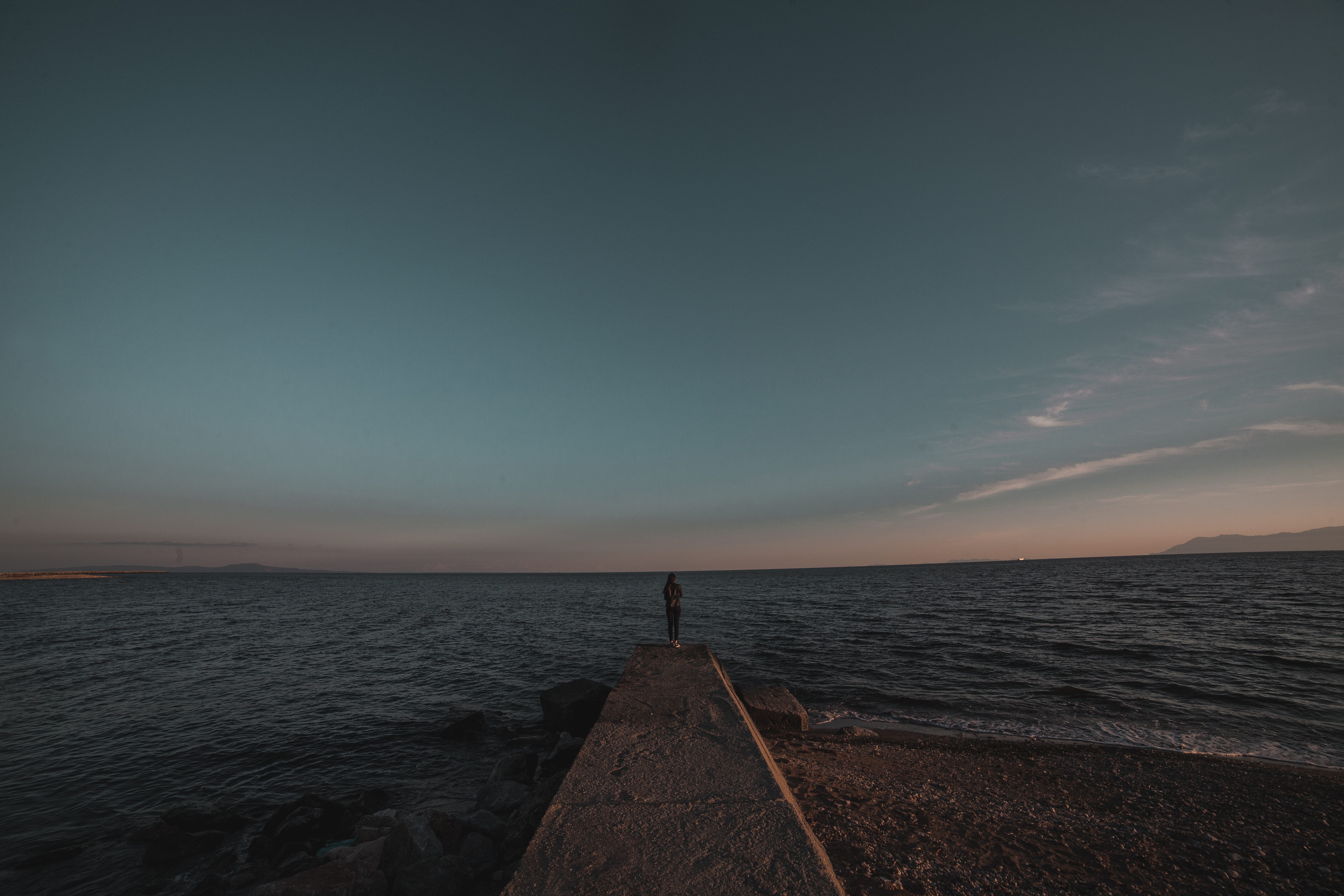 solitude, dusk, nature, non-urban scene, dock, standing, tranquil scene, horizon, leisure activity, 5K, lake, ocean, sea, real people, endless, person, HD Wallpaper
