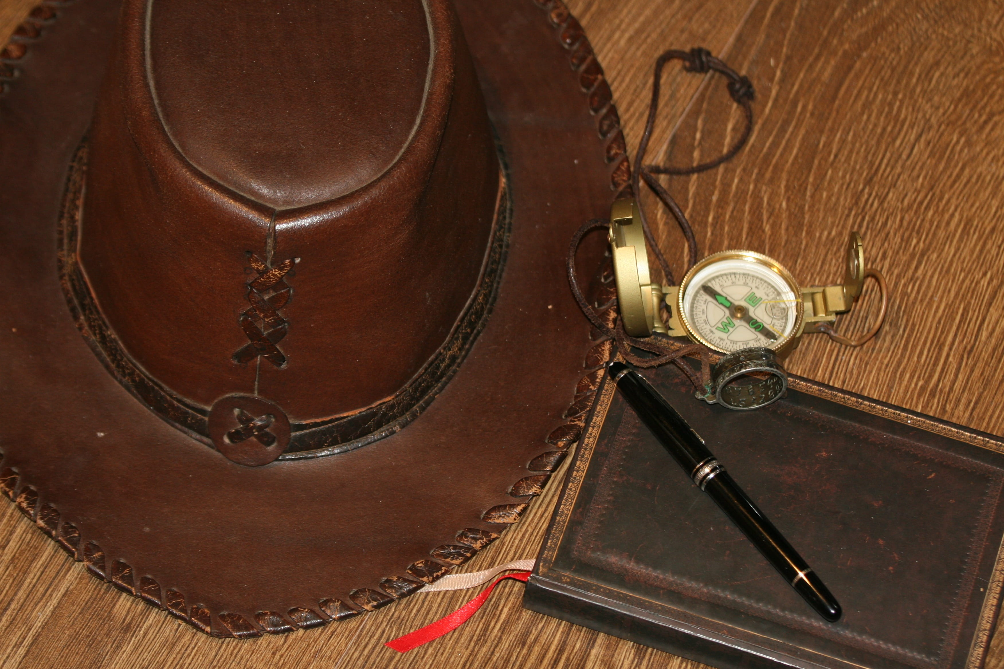 no people, leather, emotion, entrepreneur, clock, history, Travel, brown hat, chain, indoors, brown, antique, surface, compass, cowboy, bag, heading, indiana jones, HD Wallpaper