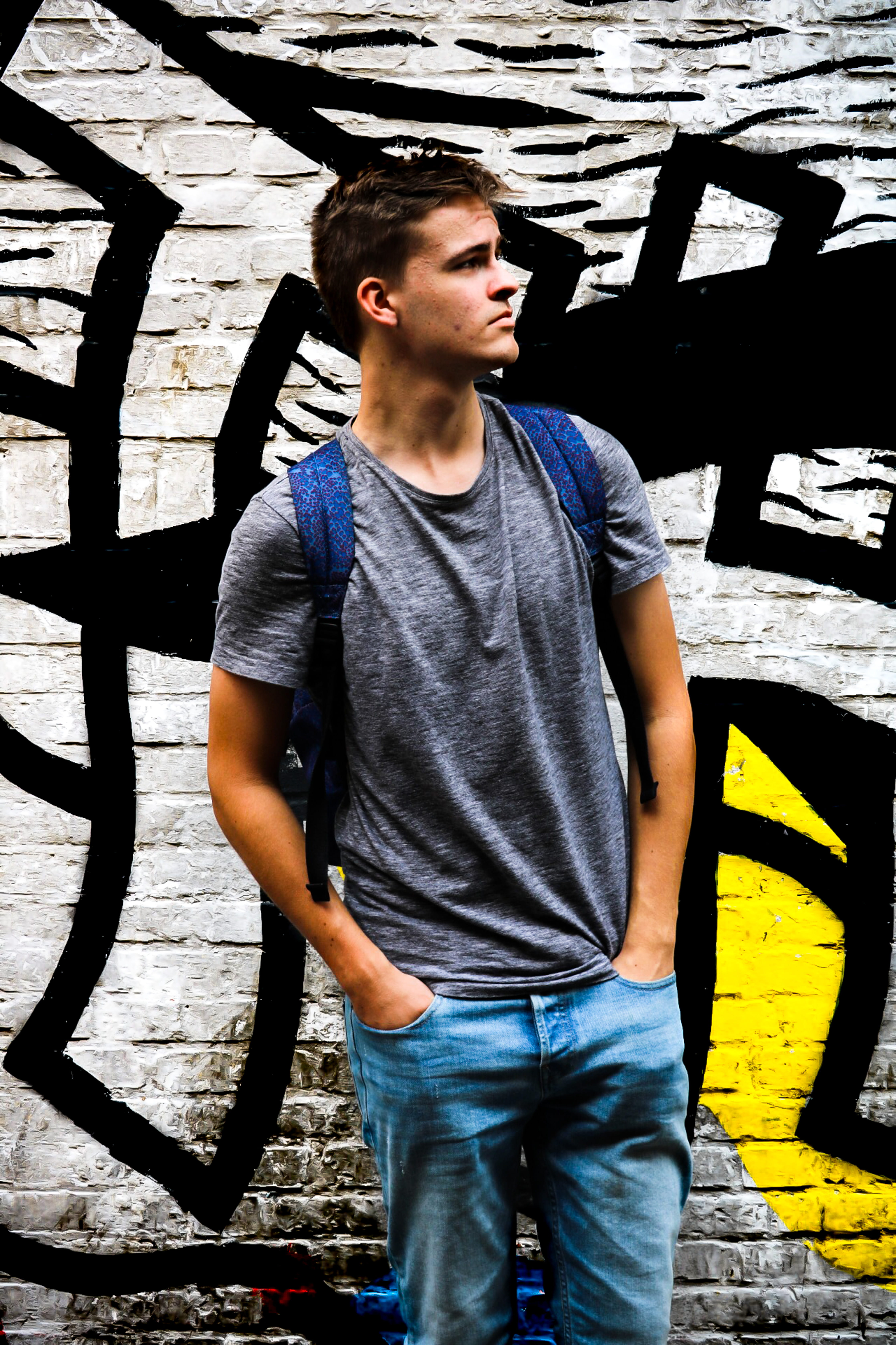 teenage boys, man, front view, three quarter length, young men, looking, yellow, teenager, backpack, hair, black, blue, architecture, sunlight, green, summer, Phone HD Wallpaper