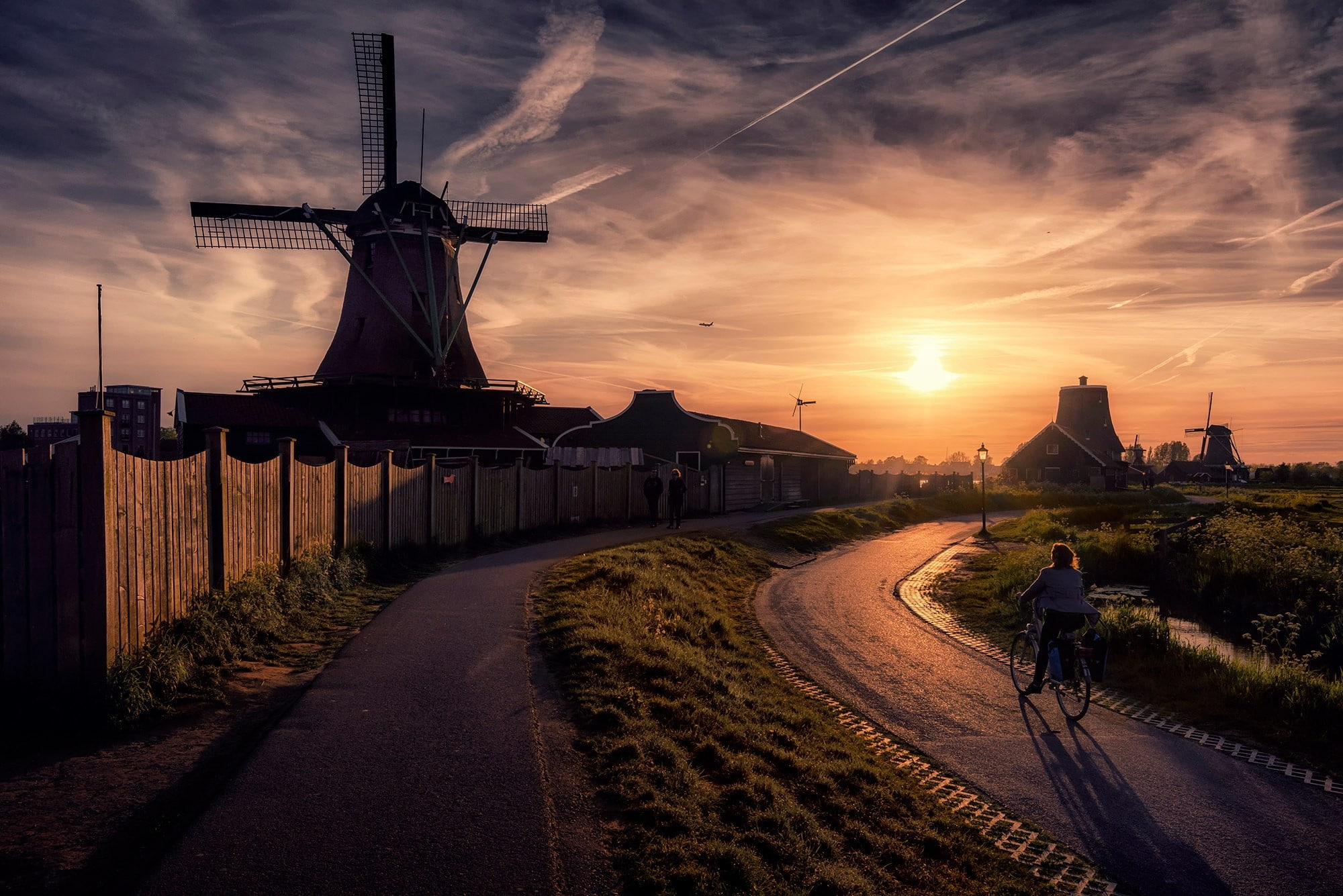 transportation, direction, city, path, real people, outdoors, sun, 1080P, sunbeam, travel, orange color, rear view, cloud - sky, built structure, building exterior, HD Wallpaper
