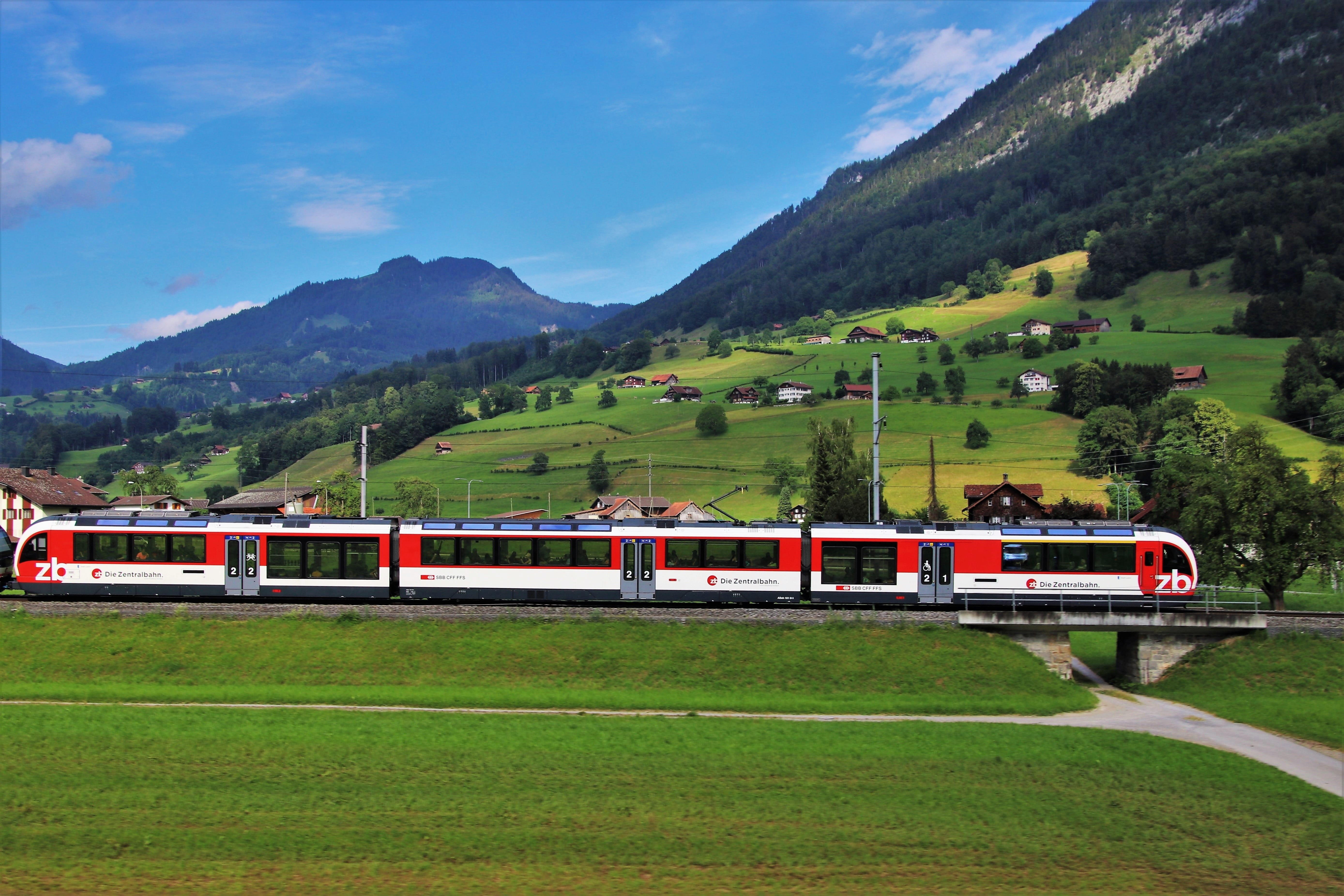 day, train, train - vehicle, field, environment, alpine village, sunny, scenics - nature, outdoors, morning, mountain range, transport, hiking trail, landscape, HD Wallpaper