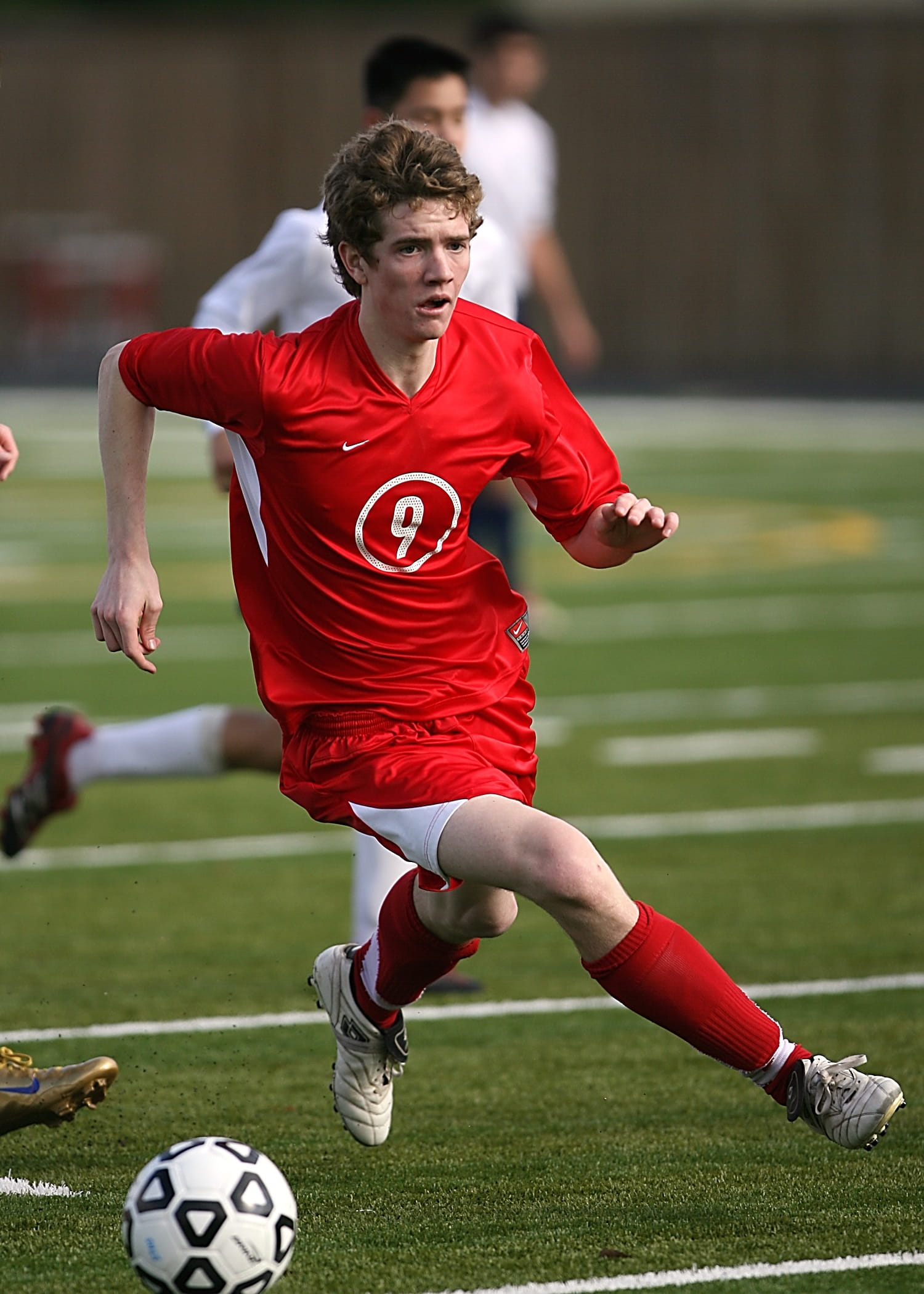 game, motion, nike, sport, shirt, sports uniform, soccer, 1080P, red, ball, competition, effort, outdoors, soccer field, sports clothing, young men, soccer player, Phone HD Wallpaper