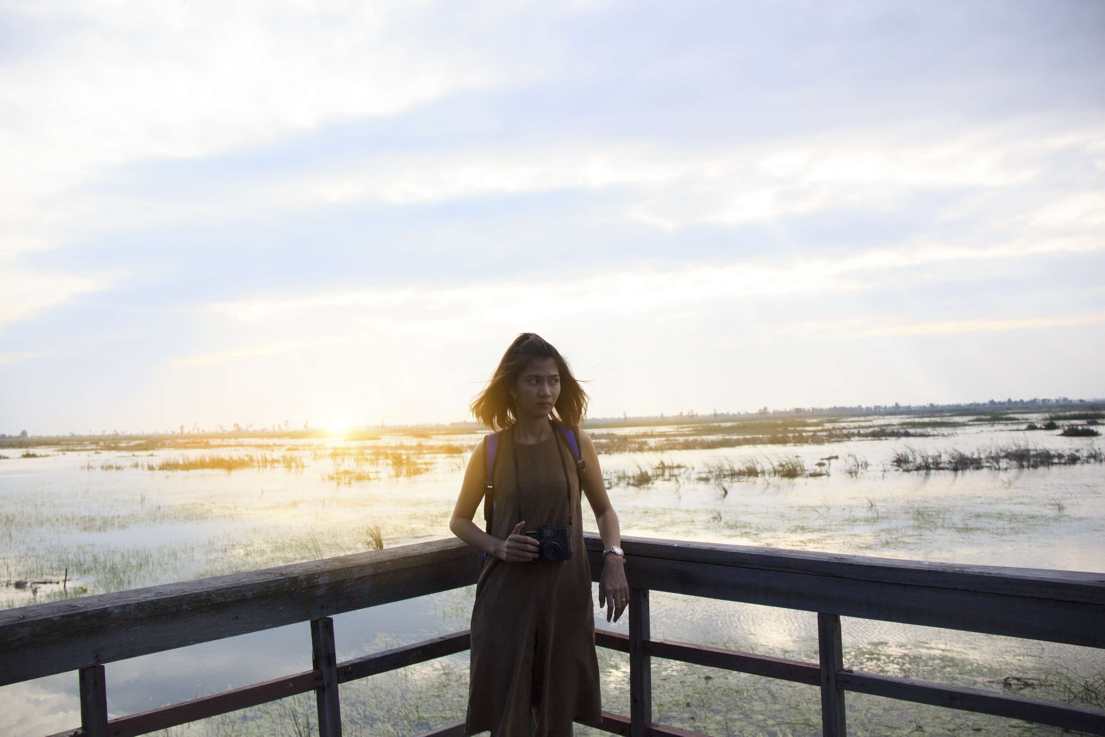 outdoors, woman, sunrise, long hair, railing, scenics - nature, 4K, beautiful woman, hair, sky, clouds, lifestyles, real people, young, women, lady, photography, HD Wallpaper