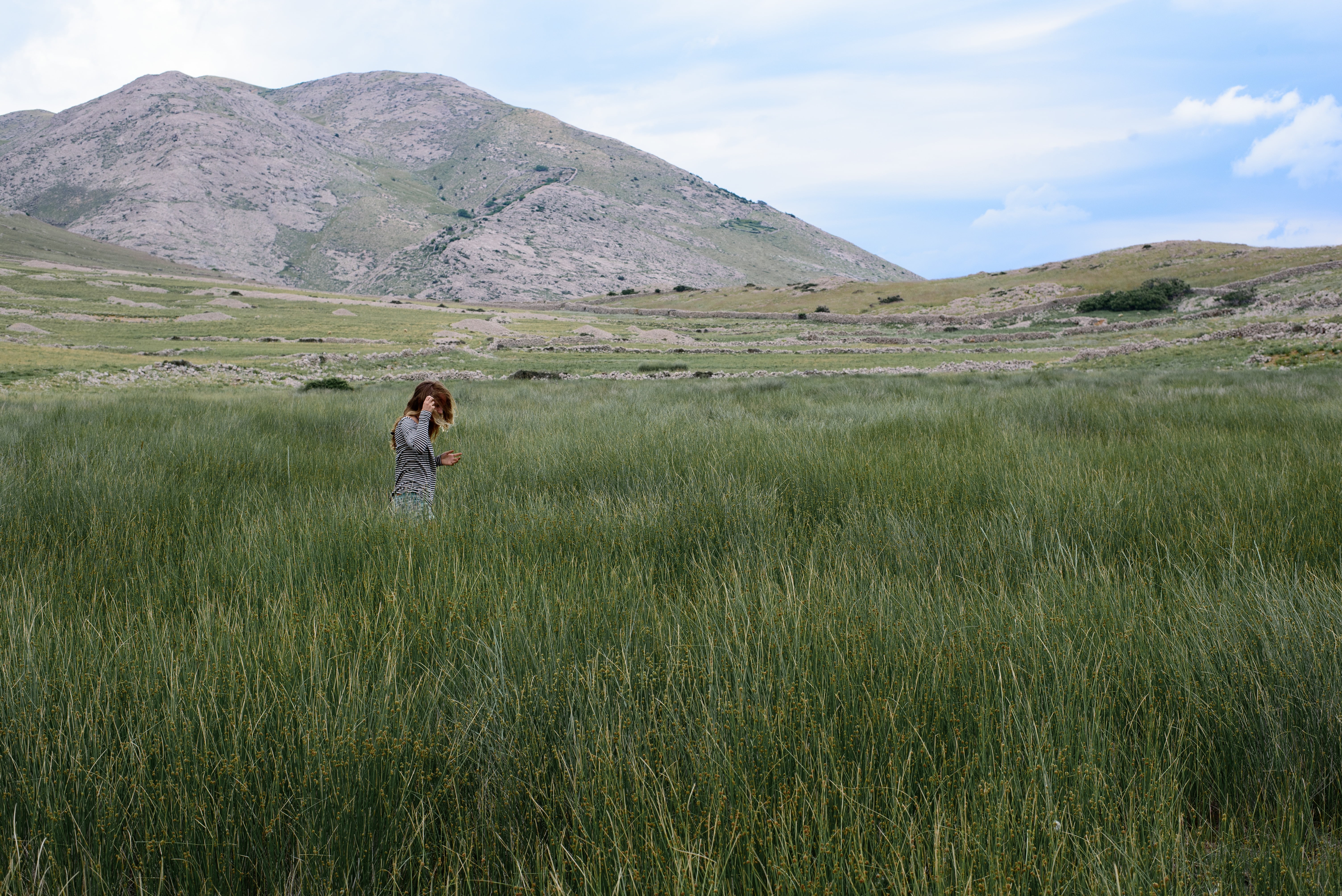 environment, people, nature, alone, woman, green, leisure activity, grass, walking, clouds, day, land, highland, long, outdoors, grassland, field, dress, HD Wallpaper