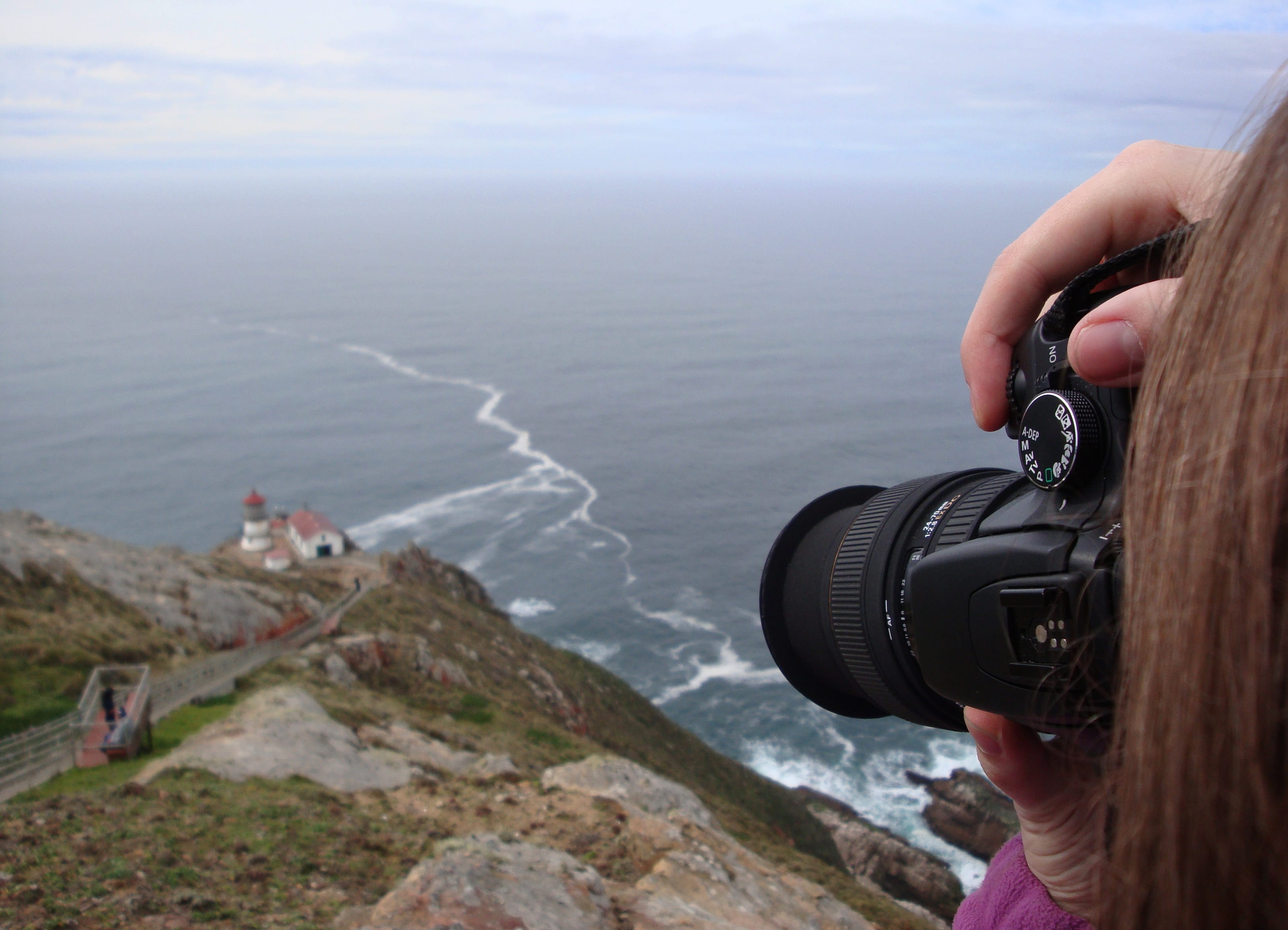 sea, coast, nature, lifestyles, photography themes, 2K, point reyes lighthouse, activity, seashore, holding, leisure activity, digital single-lens reflex camera, HD Wallpaper