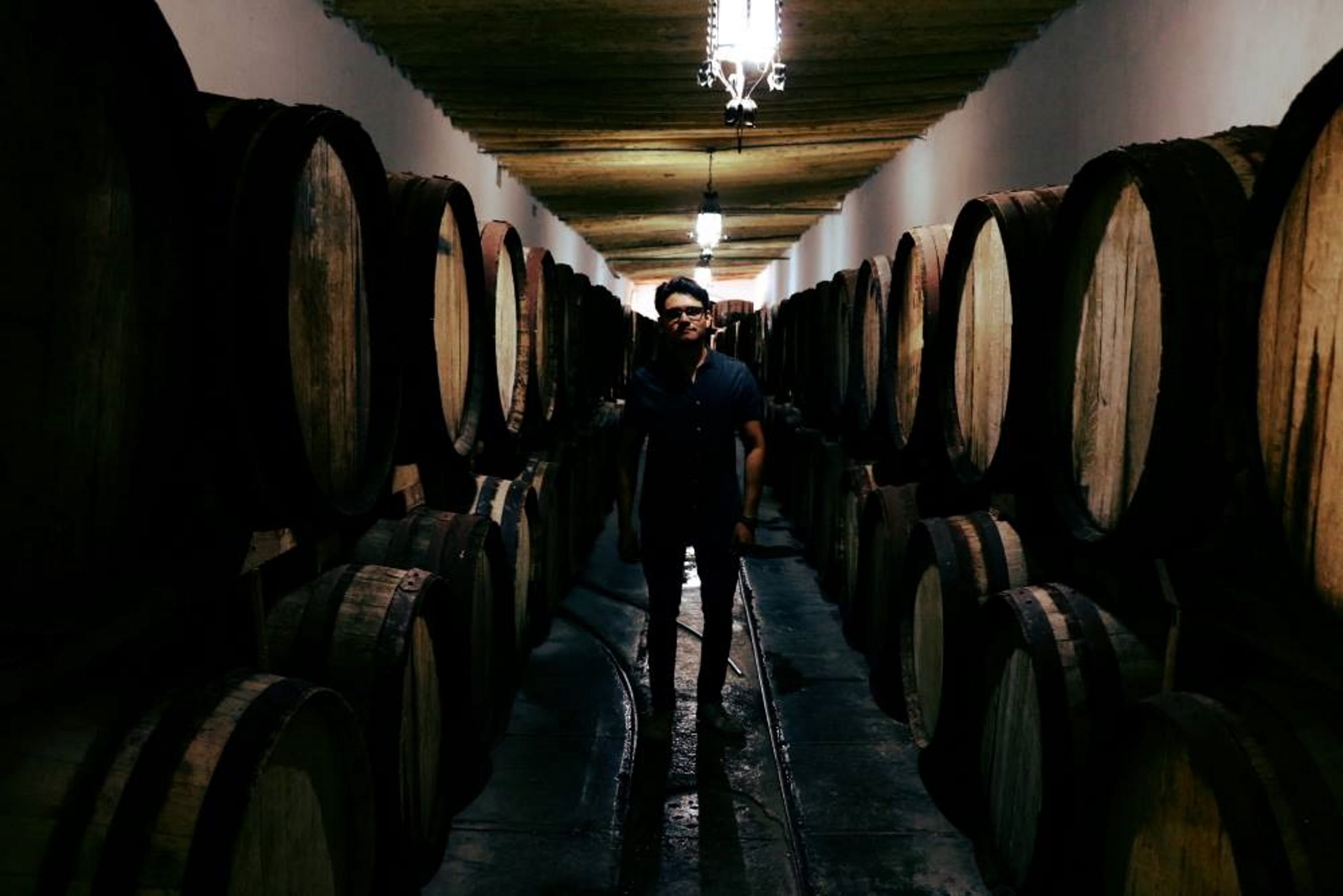 illuminated, casa madero, vintage, indoors, warehouse, cellar, barrel, drink, town, standing, old town, winery, 2K, one person, mexico, ghost town, wine cellar, HD Wallpaper