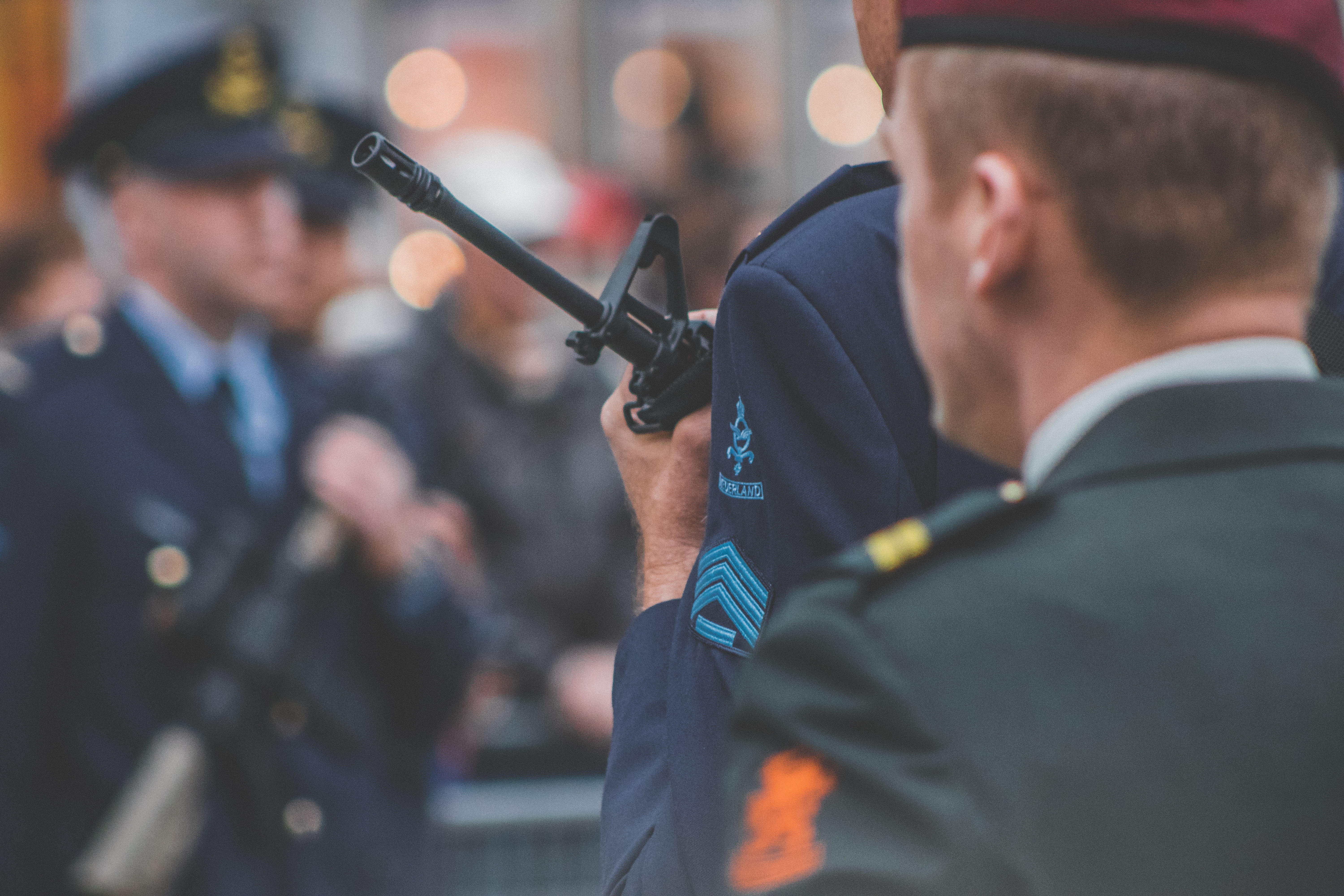 looking, badge, security, wepon, color, stripes, dom, 5K, depth, shift, bokeh, males, terror, press, army, shallow, uniform, holding, man, photo, aggression, HD Wallpaper