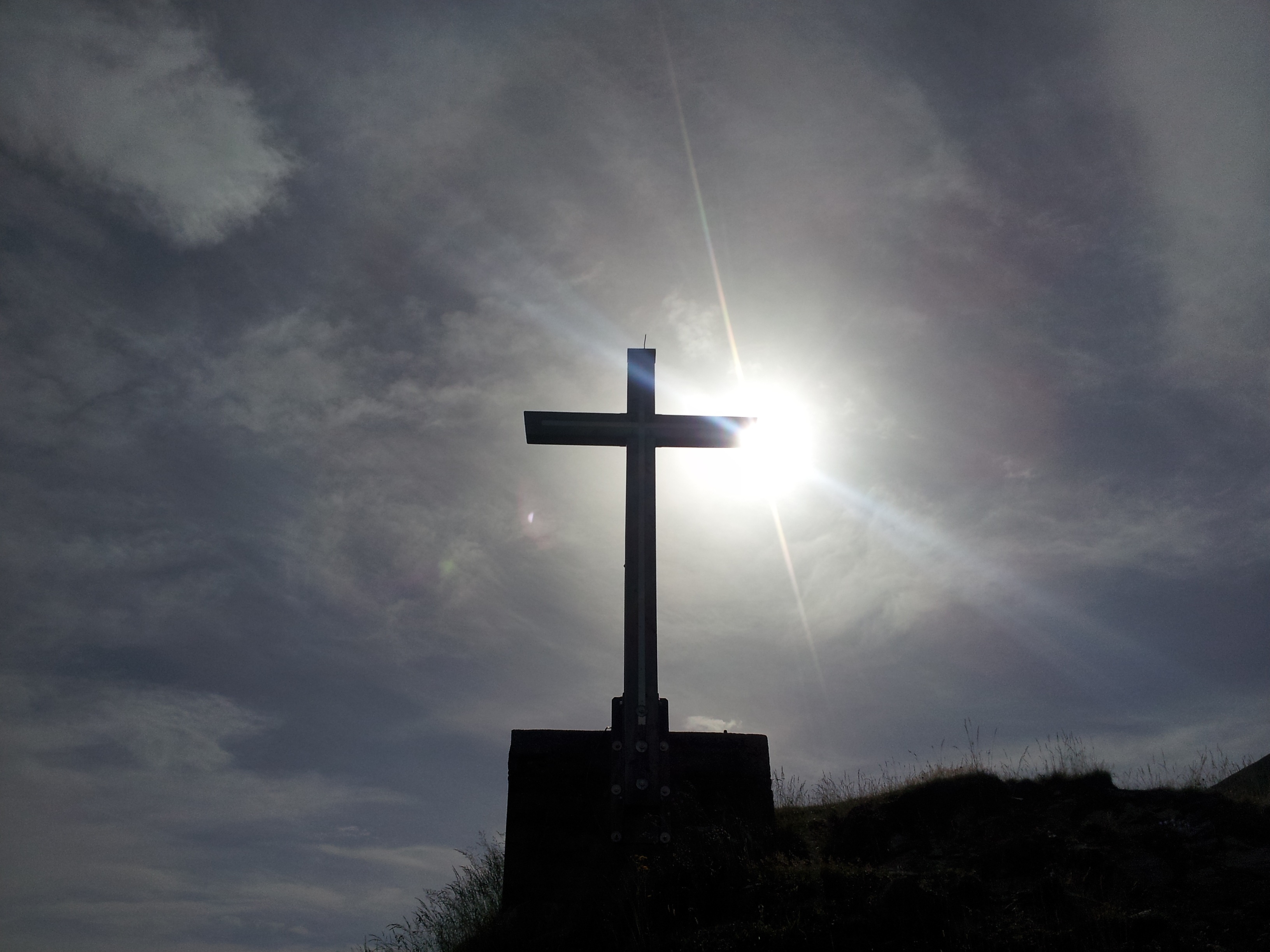 crucifix, architecture, cloud - sky, spirituality, summit, sunlight, built structure, alpine, belief, sun, daytime, religion, cross shape, outdoors, sunbeam, HD Wallpaper