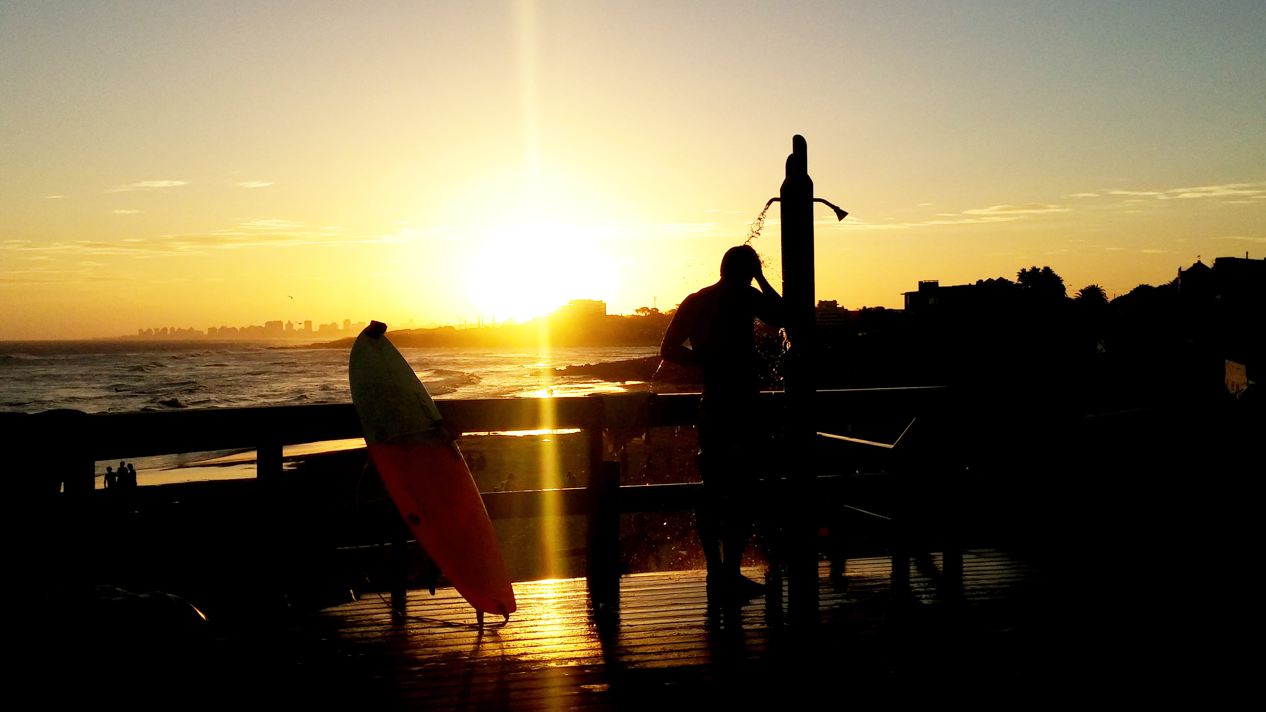 surfer, shore, swimming pool, relaxation, one person, shower, people, sky, lifestyles, reflection, orange color, dusk, real people, beach, near, water, HD Wallpaper