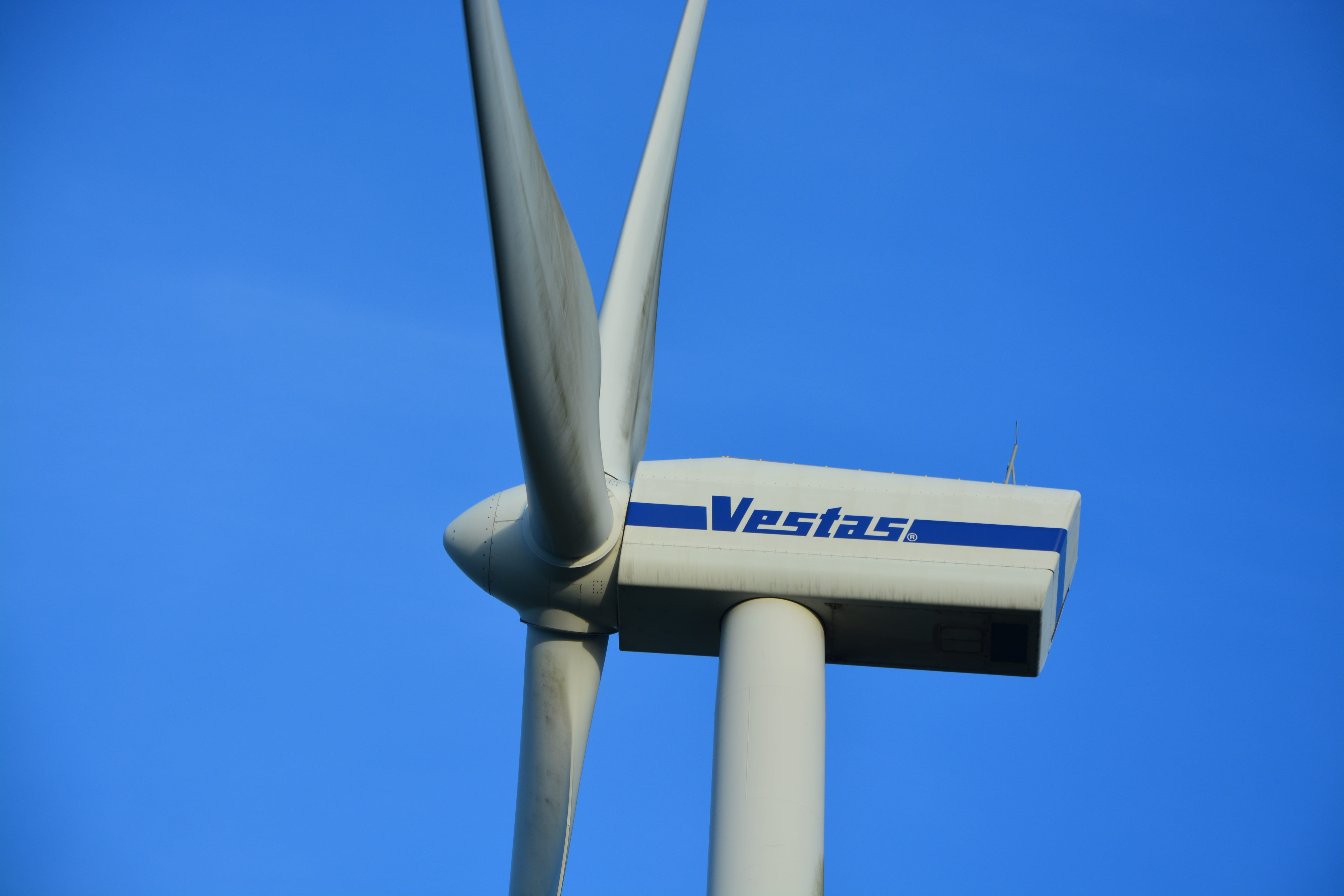 western script, low angle view, directional sign, message, clear sky, text, direction, outdoors, contemporary form, wind turbine, communication, day, arrow symbol, HD Wallpaper