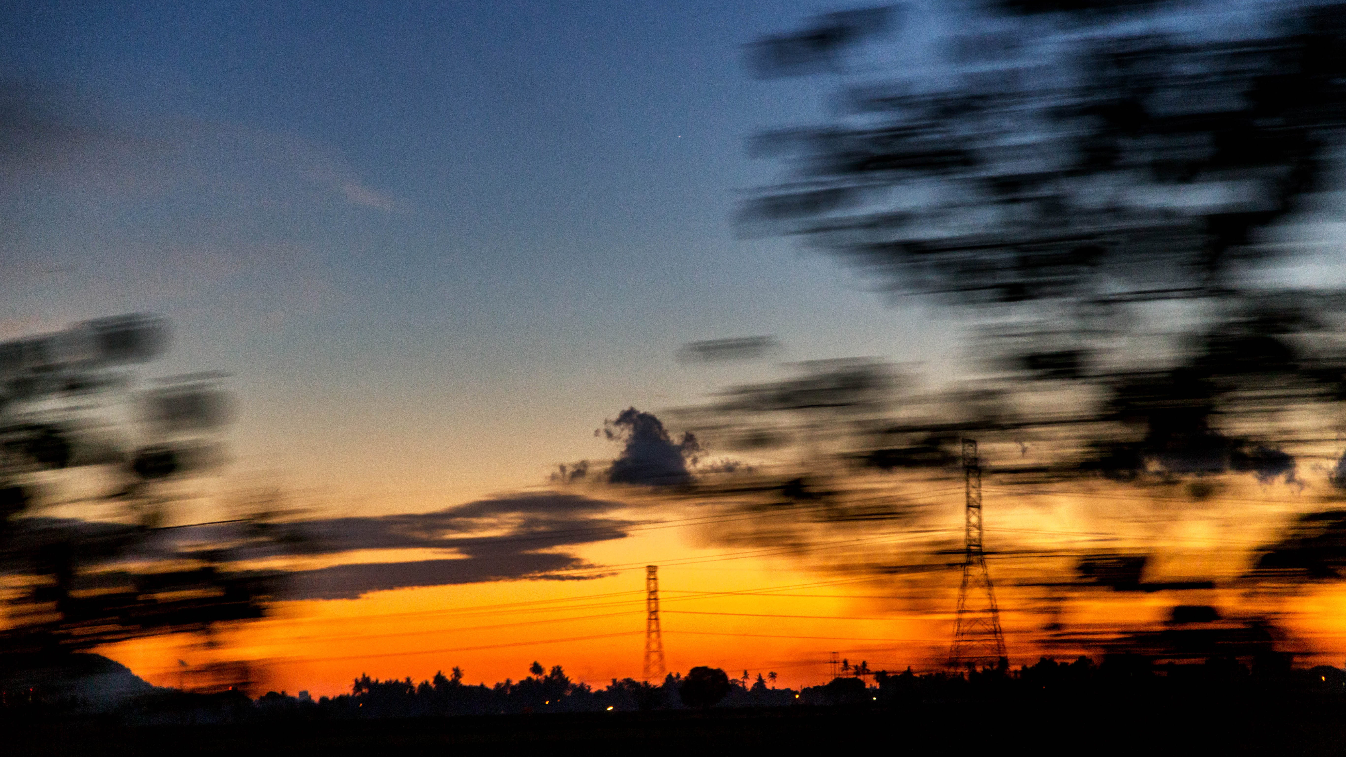 blurred motion, 5K, cityscape, dawn, no people, architecture, beauty in nature, outdoors, machine, motion, transmission, dramatic sky, sunset, cloud - sky, HD Wallpaper