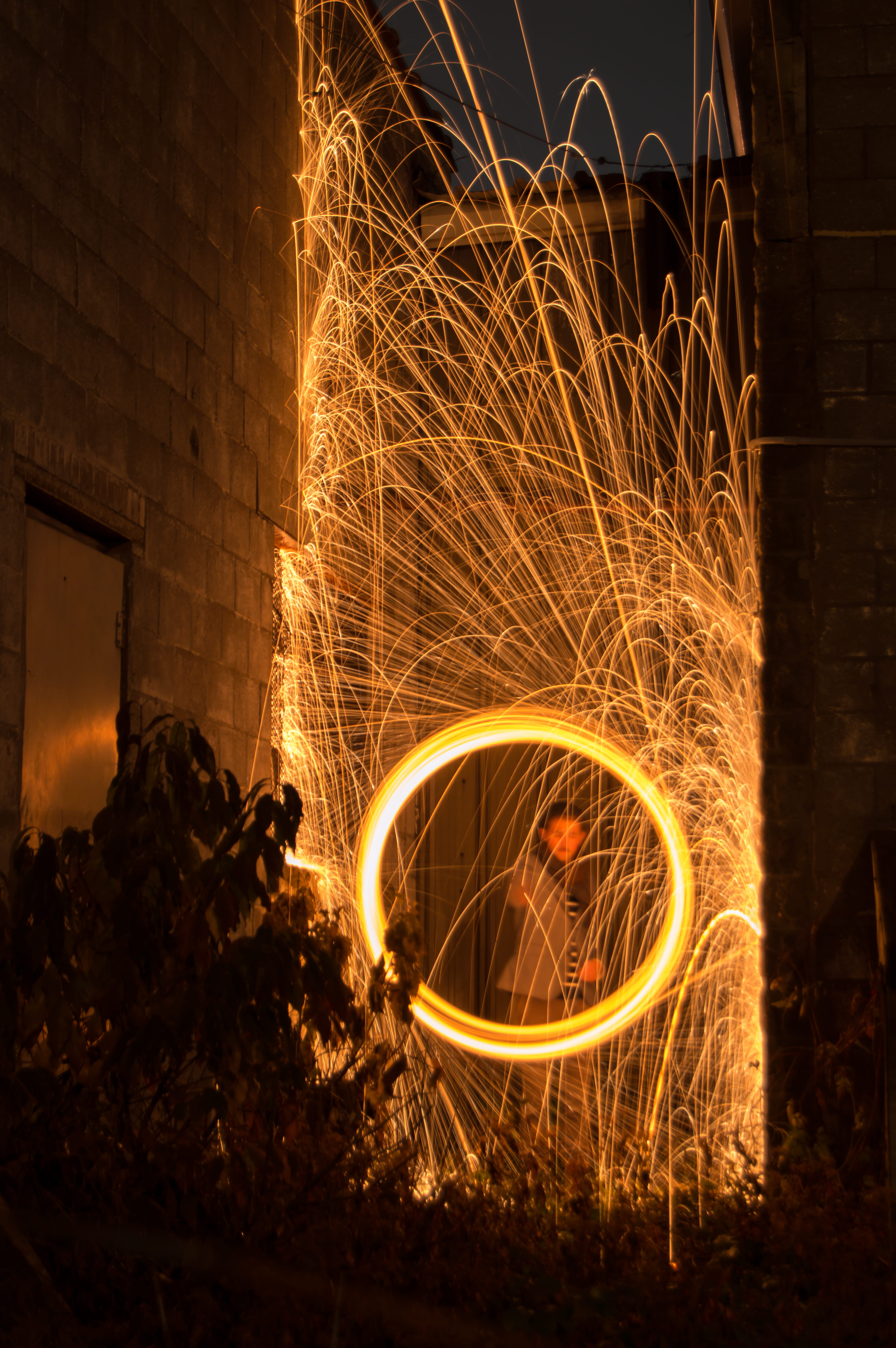 spinning, long exposure, fire, blurred motion, 5K, architecture, nature, built structure, building, illuminated, light, light trails, night, glowing, sparks, Phone HD Wallpaper