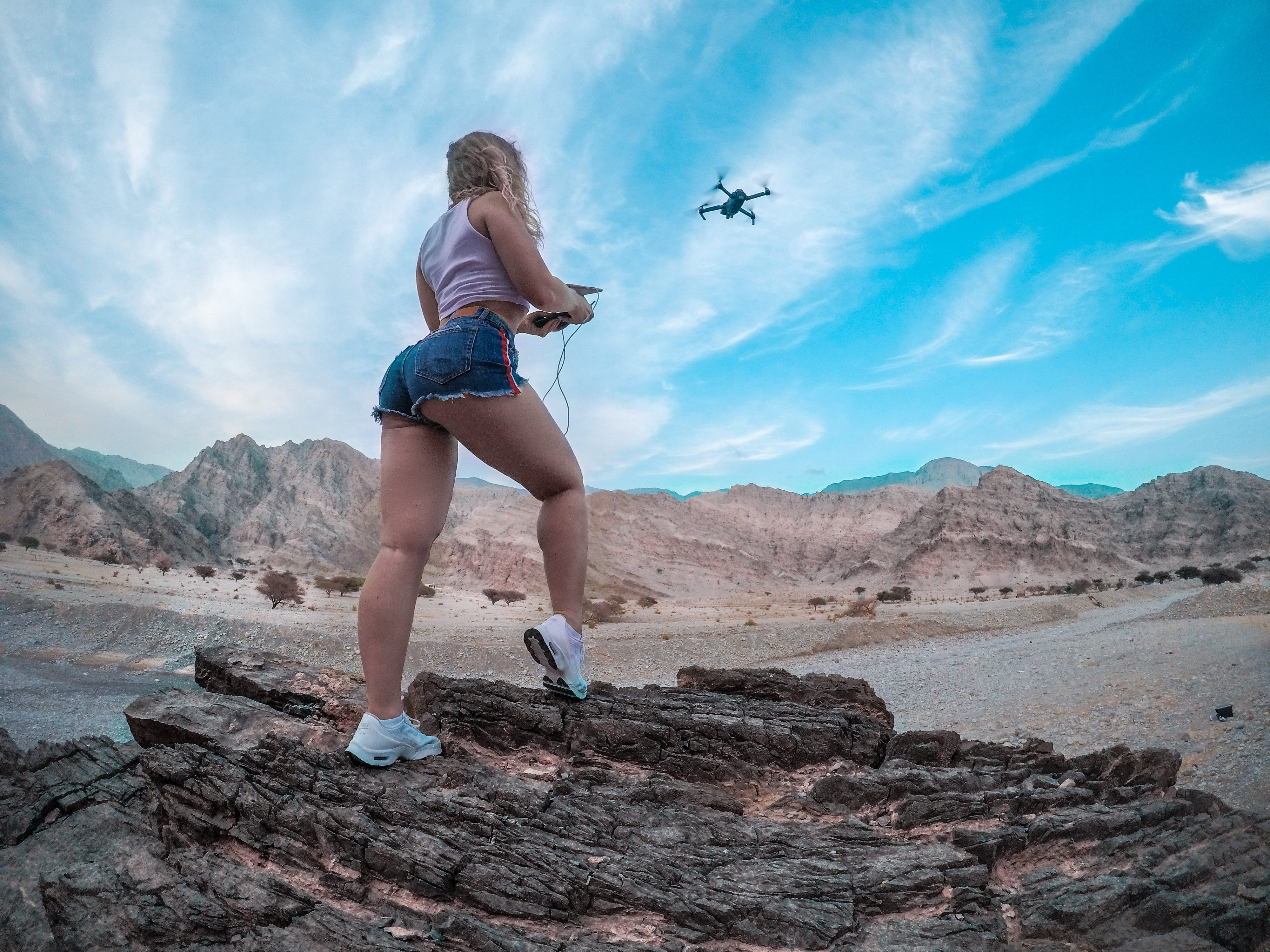 cloud - sky, shorts, beauty in nature, adult, landscape, mountain, young women, flying drone, one person, hobby, low angle shot, exercising, healthy lifestyle, HD Wallpaper