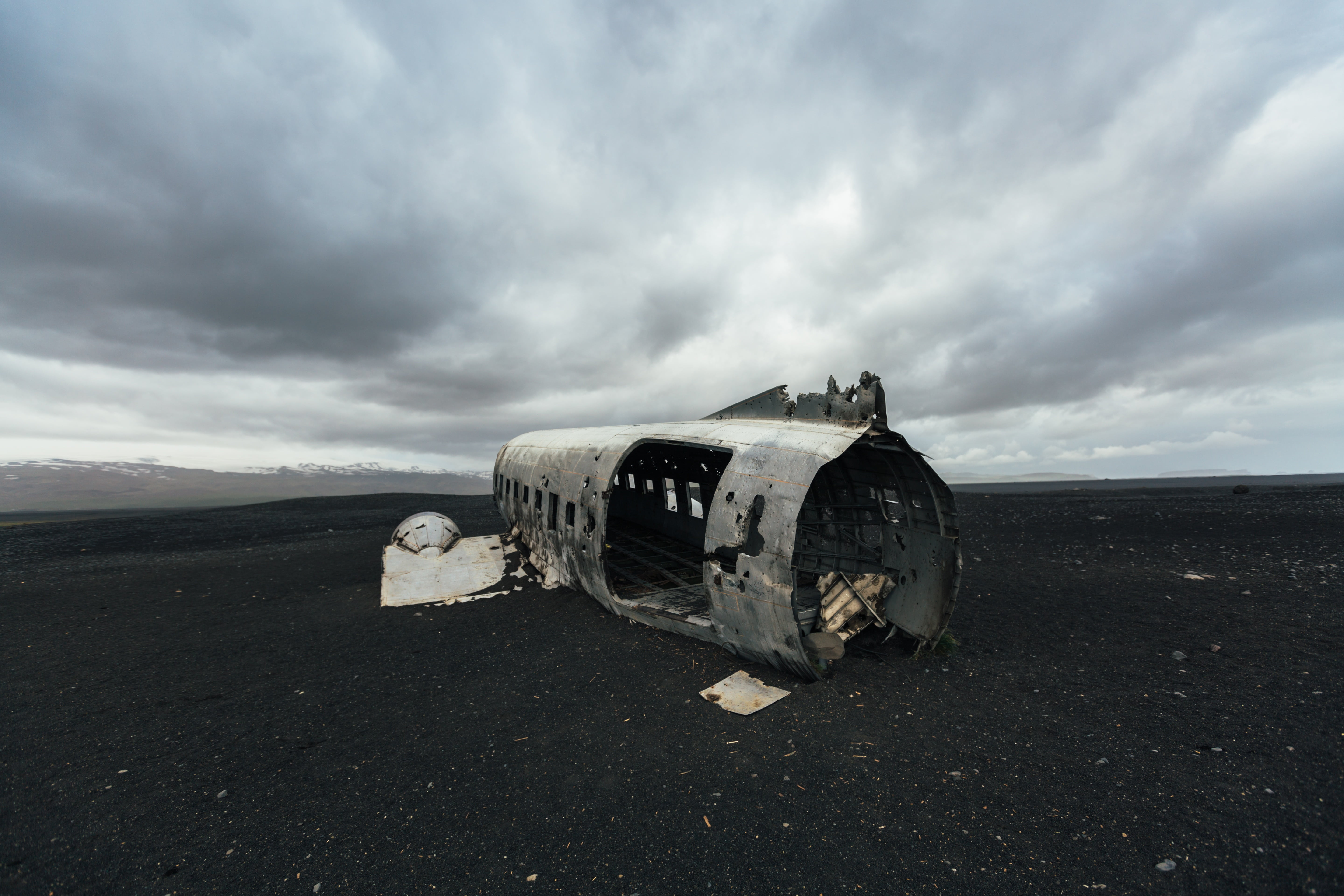 cloud - sky, airplane, dark, grayscale, air vehicle, outdoors, nature, military airplane, transportation, gray, clouds, sand, demolished, environment, destruction, HD Wallpaper