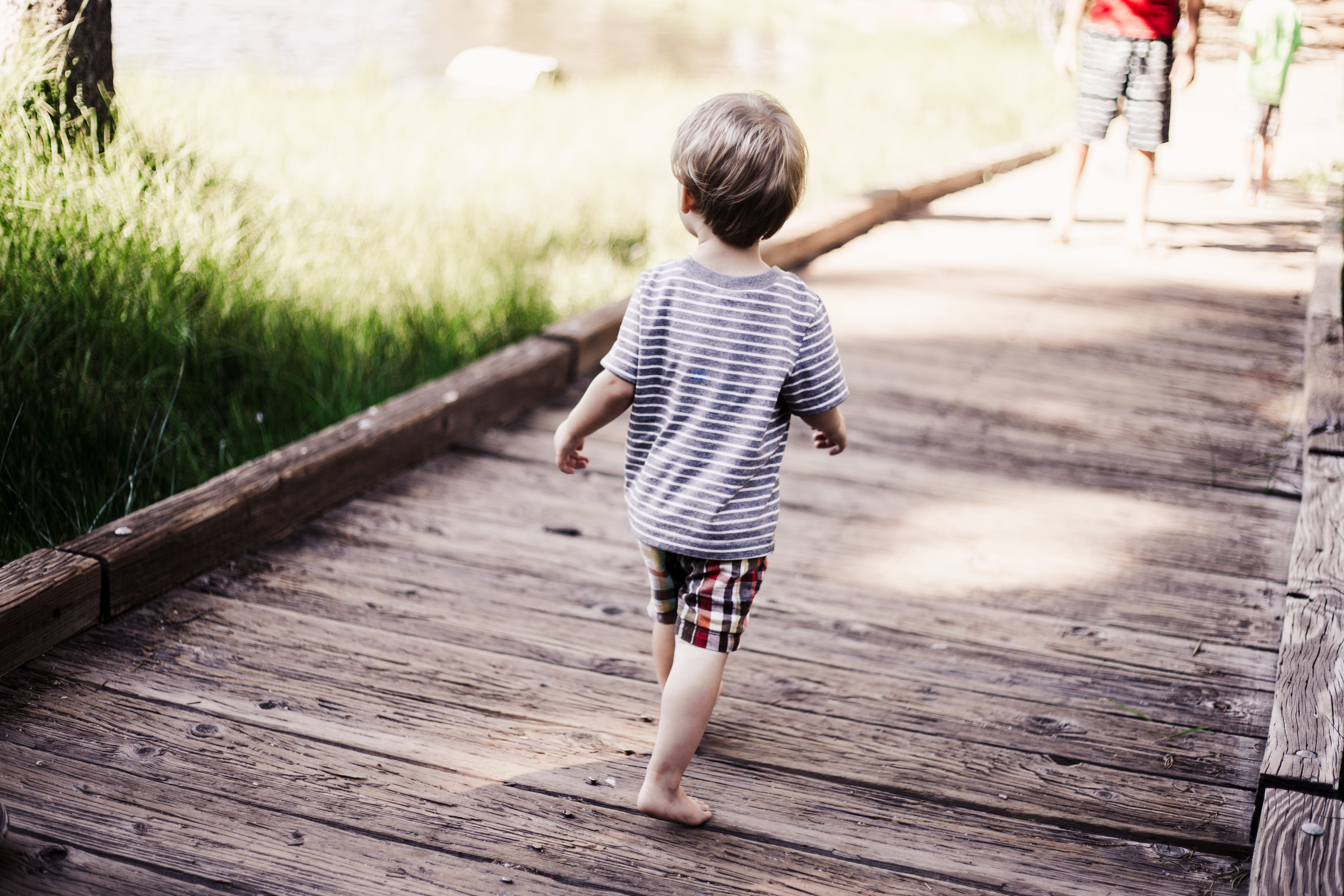 males, wood - material, men, young boy, wooden pathway, playing, walking, full length, brother, one person, children walking, child, laughing, real people, HD Wallpaper