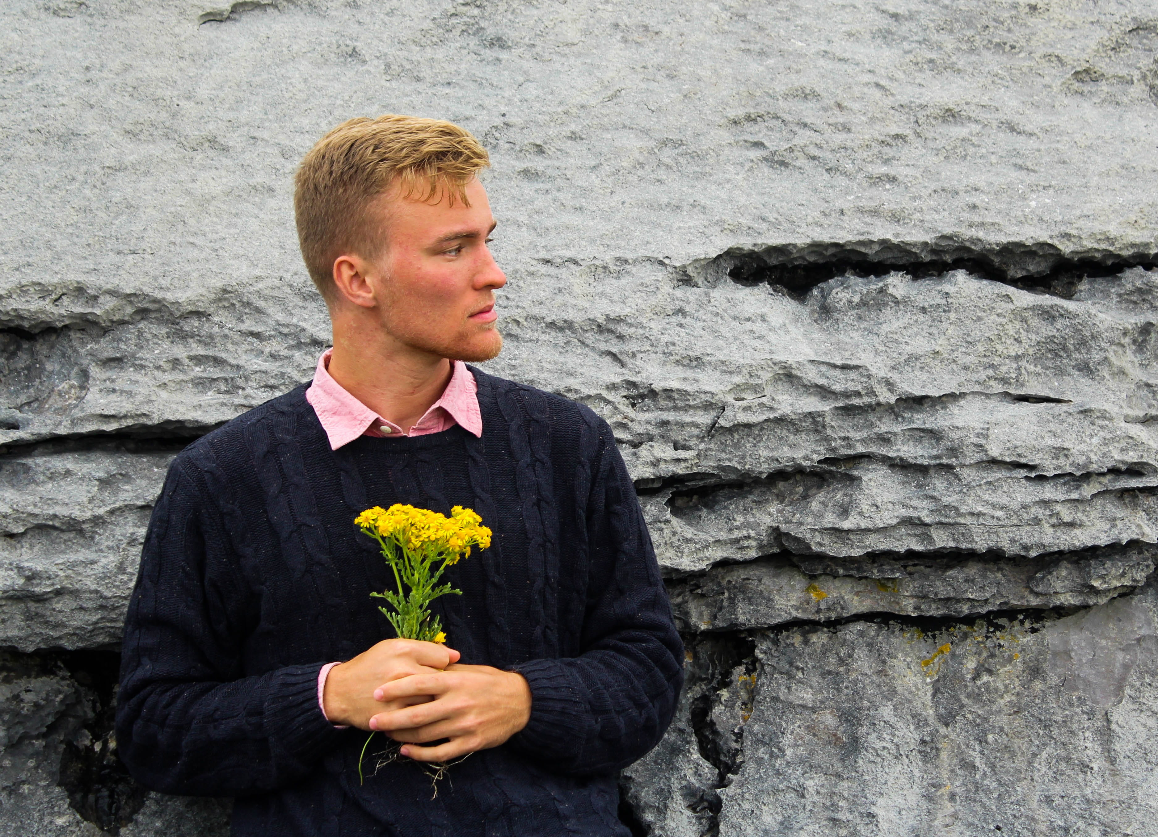 lifestyles, travel, plant, contemplation, depression - sadness, males, 2K, looking, flower head, outdoors, sadness, day, cliffs of moher, sweater, real people, HD Wallpaper