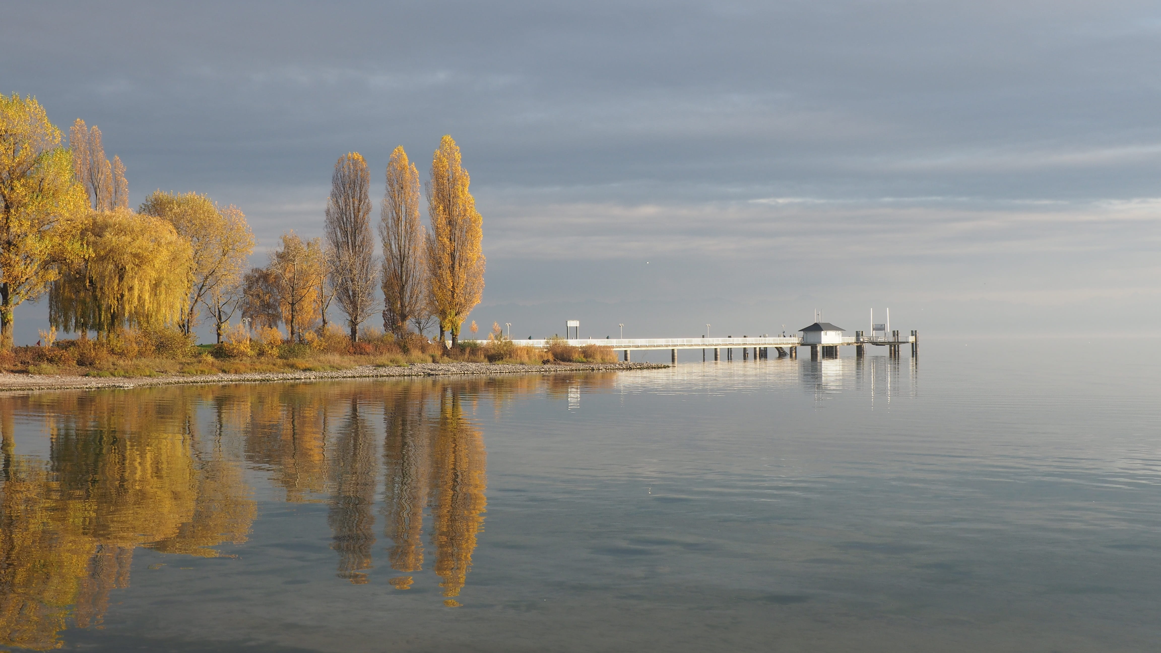 tranquil scene, tree, no people, headland, landscape, distance, remote, idyllic, nature, view, bank, outdoors, lake, tranquility, beauty in nature, panorama, HD Wallpaper