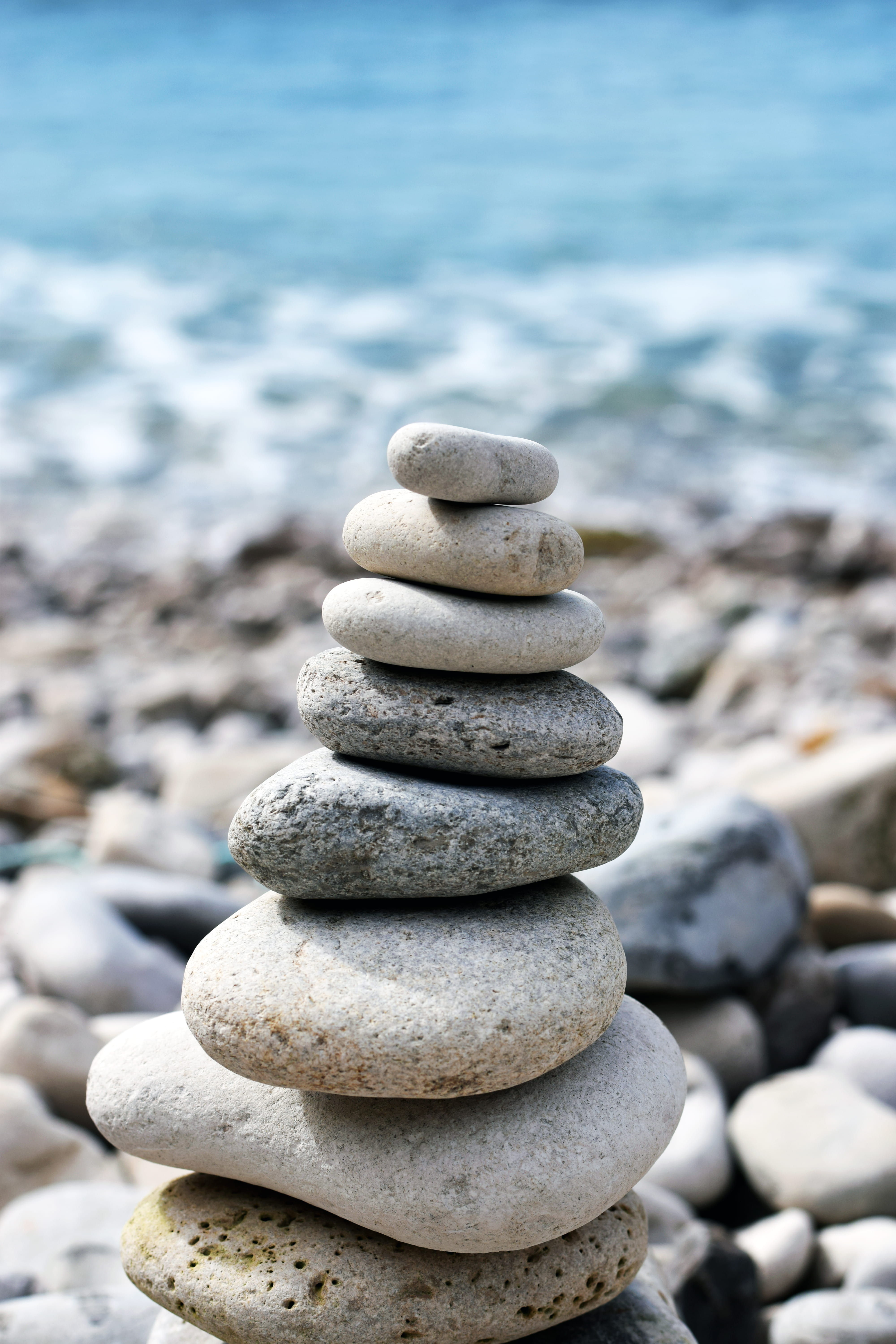 shallow depth of field, 5K, beach, stack, tranquility, solid, focus on foreground, zen-like, sea, stone, pebble, dof, depth of field, water, no people, Phone HD Wallpaper