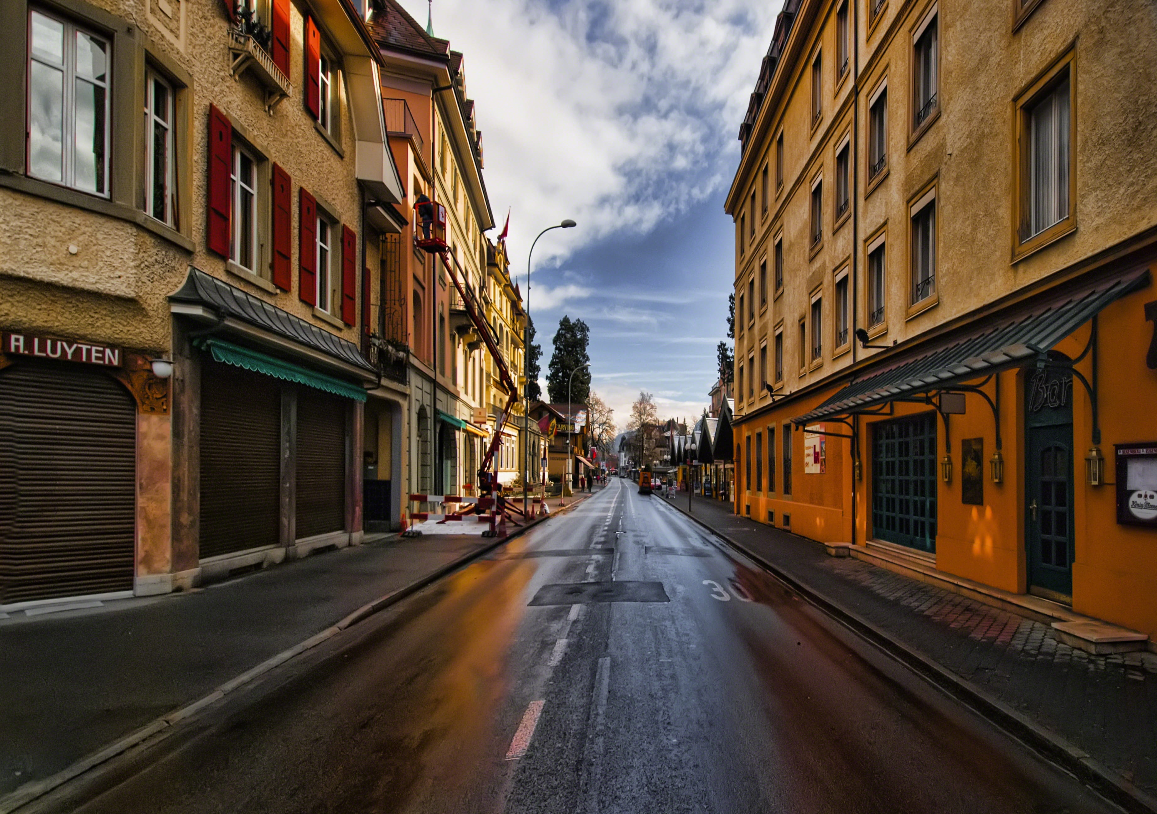 buildings, road, urban, wet, building, residential district, downtown, town, narrow, sky, no people, street, direction, city, diminishing perspective, built structure, HD Wallpaper