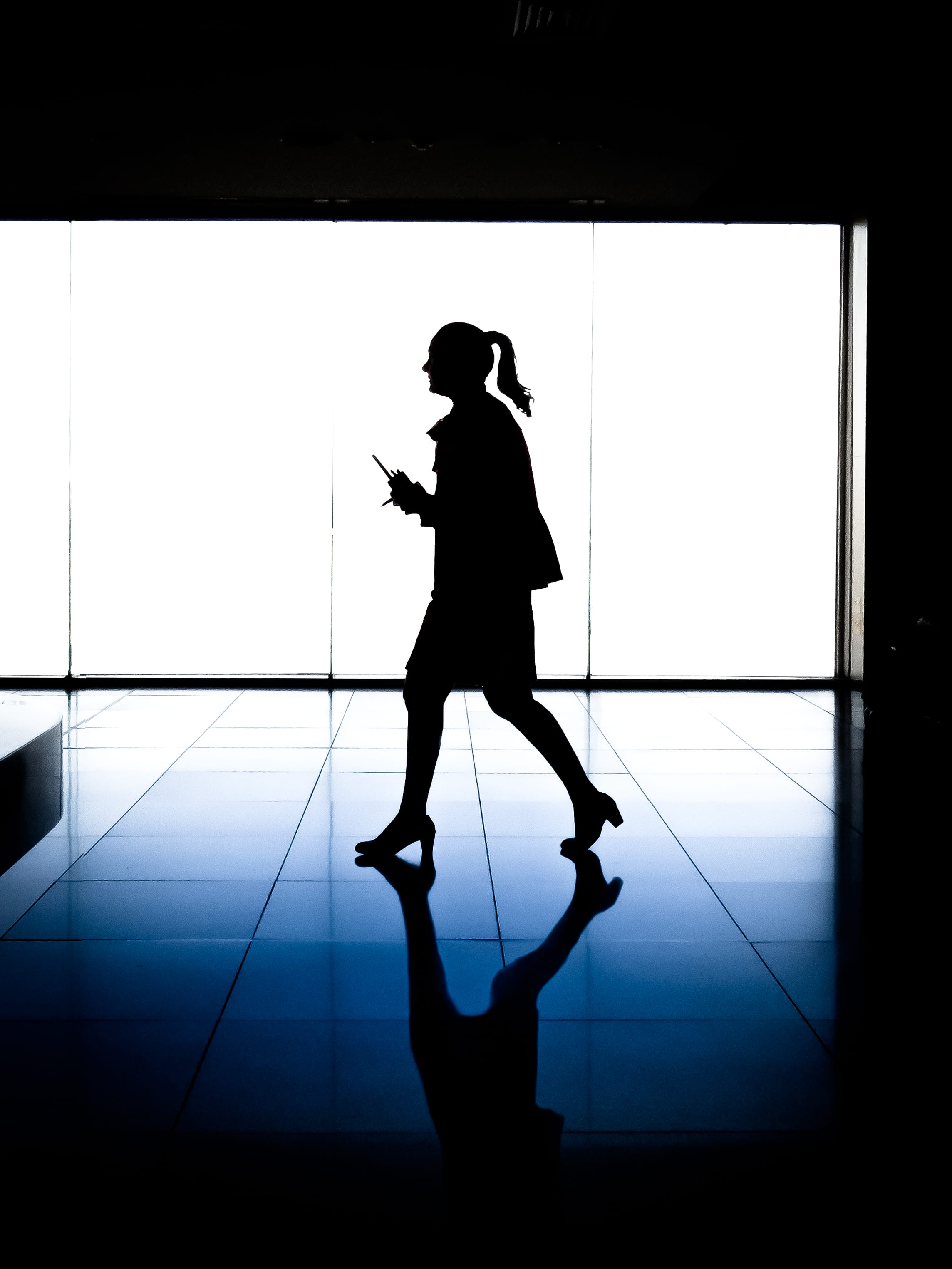 transfer print, tile, glass, reflection, men, one man only, holding, silhouette, wall - building feature, striding, person, standing, tiled floor, day, Phone HD Wallpaper